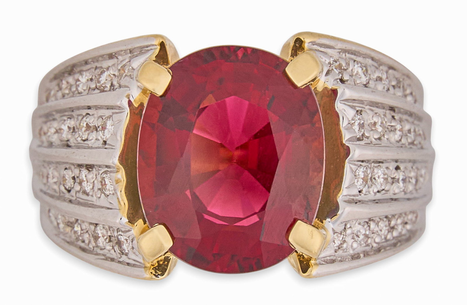14K Ruby & Diamond Ring: 14K yellow gold cocktail ring, set with large oval cut ruby center stone, accented by rows of round cut diamonds to shank, marked "14K" Size: 6 Total weight: 7.6 g Provenance: Property
