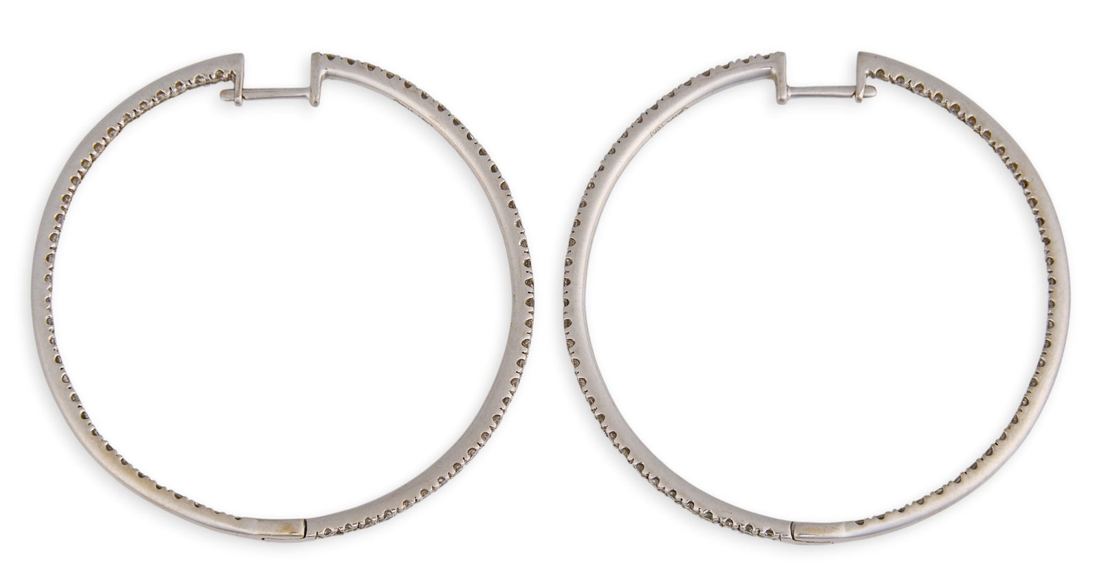 18K Diamond Hoop Earrings: Pair of 18K white gold hoop earrings, set with round cut diamonds, marked "18K" Size: 1.75 in. diameter Total weight: 8.6 g Provenance: Property from a home in San Antonio, Texas