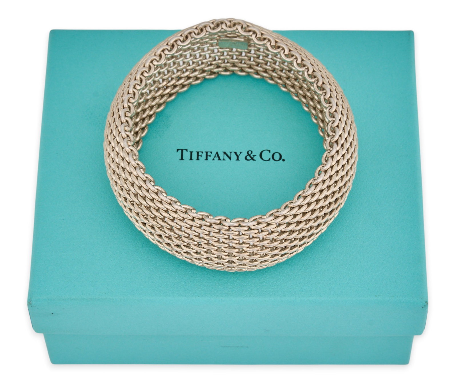 Tiffany & Co. Sterling Silver Mesh Bracelet: Tiffany & Co. sterling silver mesh bracelet cuff, marked "Tiffany & Co. 925", with Tiffany box Circumference: 7.5 in. Total weight: 4.015 ozt Provenance: Property from the personal
