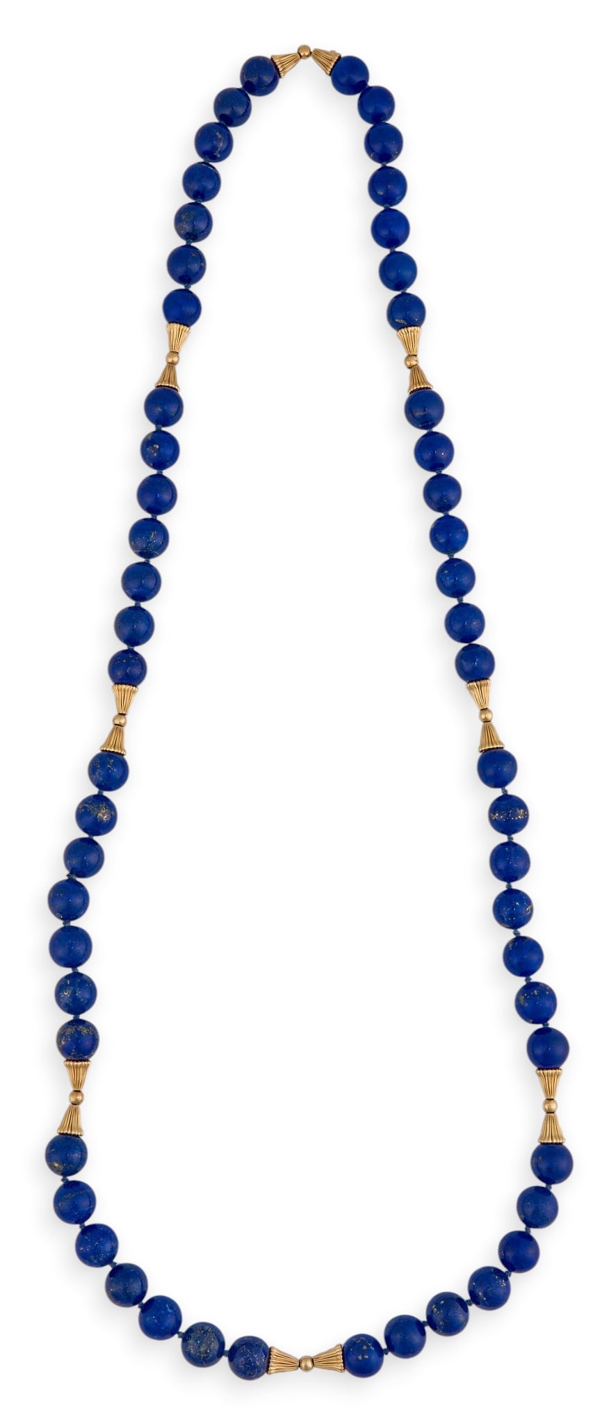 14K Beaded Lapis Necklace: 14K yellow gold (tested) beaded lapis necklace, composed of round dyed lapis beads Length: 31 in. Provenance: Property from the Estates of Lewis and Catharine Cocke “Tinka” Tarver, no
