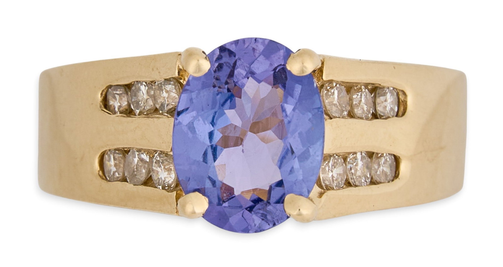 14K Tanzanite & Diamond Ring: 14K yellow gold ring, set with oval tanzanite center stone, accented by rows of round diamonds, marked "14K" Size: 7 Total weight: 6.8 g Provenance: Property from an estate collection