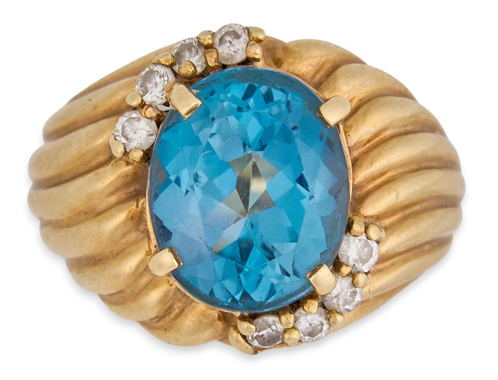 14K Blue Topaz & Diamond Ring: 14K yellow gold cocktail ring, set with large oval blue topaz center stone, accented by eight round cut diamonds, with ribbed design, marked "14K" Size: 6.5 Total weight: 11.0 g
