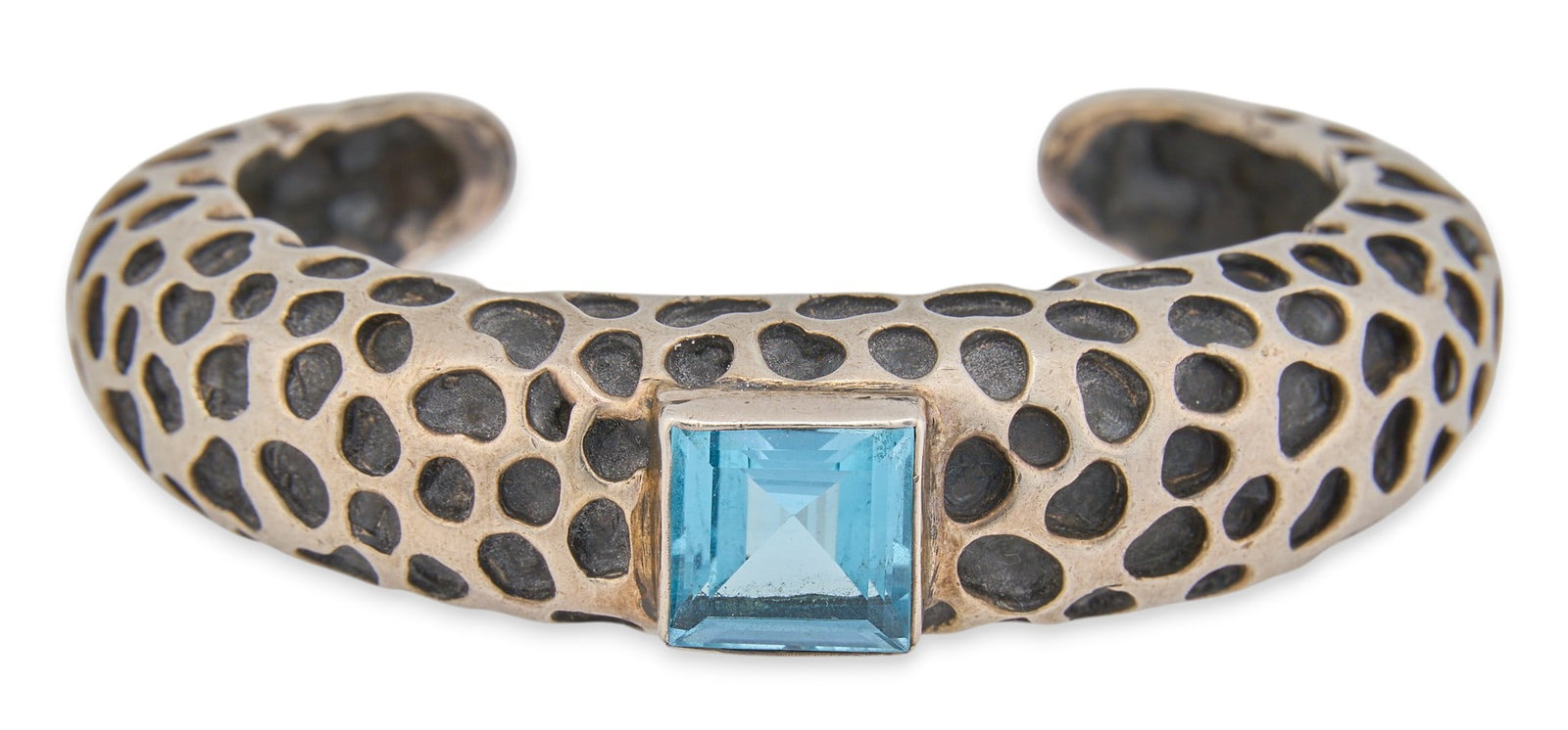 Dian Malouf, Sterling Silver & Topaz Cuff: Dian Malouf, textured sterling silver cuff, set with single square cut blue topaz center stone, marked "DLM .925 14K" Circumference: 6.25 in. Total weight: 1.815 ozt Provenance: Property