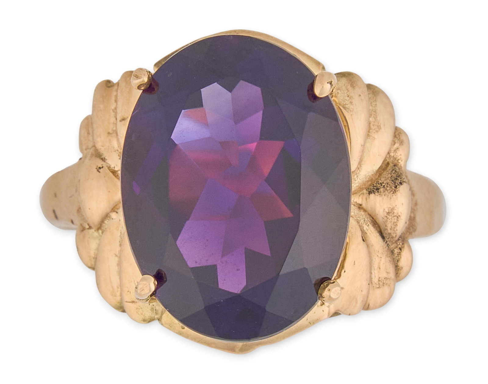 14K Amethyst Cocktail Ring: 14K yellow gold cocktail ring, set with large oval amethyst center stone, marked "14K" Size: 9 Total weight: 5.6 g Provenance: Property from an estate collection at a home in the