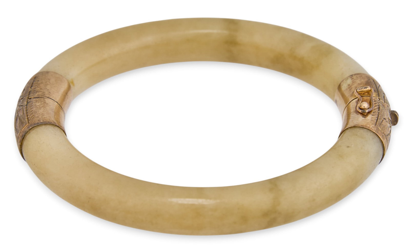 14K Hinged Jade Bangle: 14K yellow gold hinged cuff bracelet, composed of jade body and gold hardware, marked "14K" Circumference: 6.5 in. Total weight: 40.4 g Provenance: Property from an estate collection at a