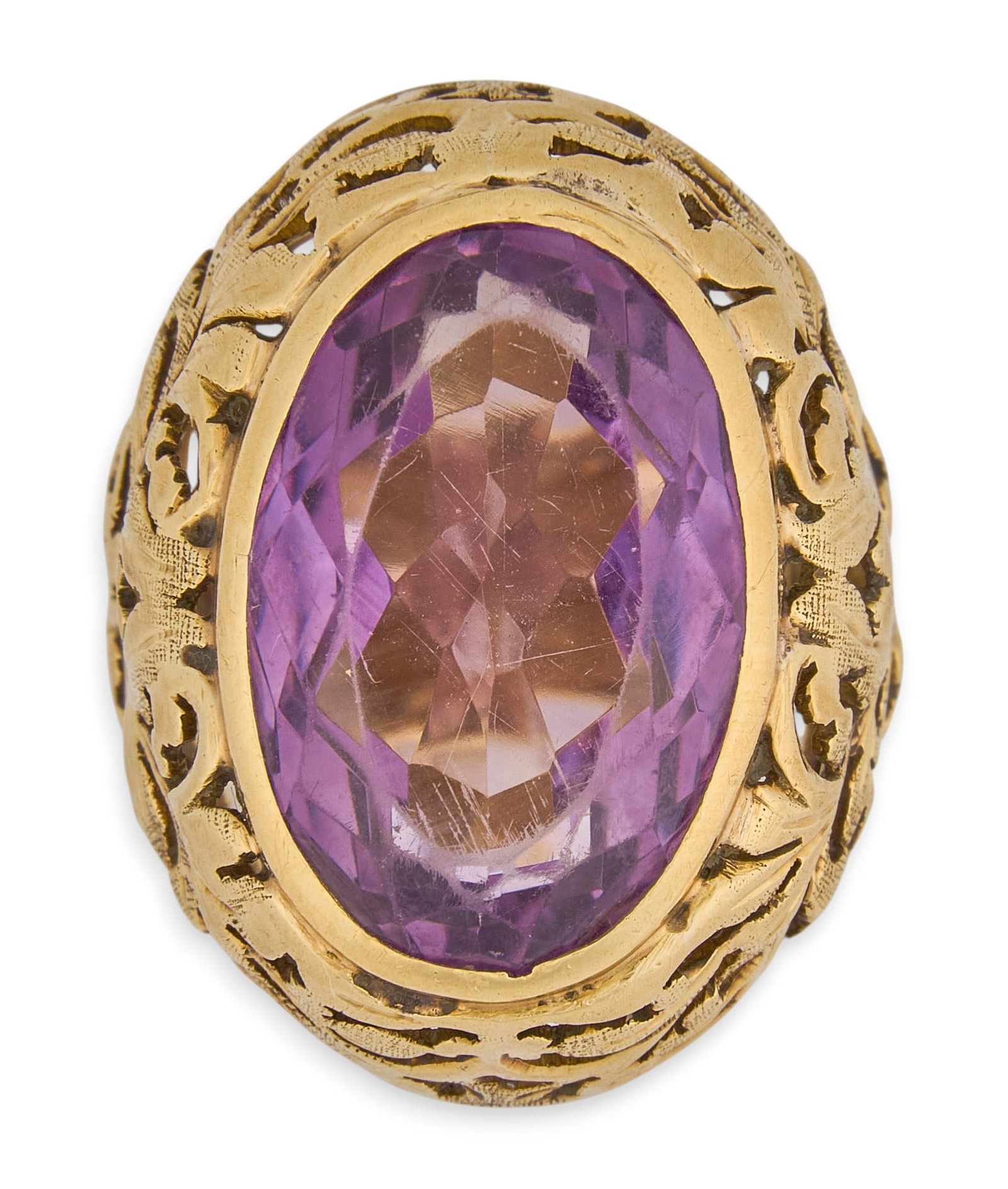 18K Amethyst Cocktail Ring: 18K yellow gold (tested) cocktail ring, set with single oval cut amethyst, with pierced framework Size: 5 Total weight: 13.6 g Provenance: Property from an estate collection at a home in