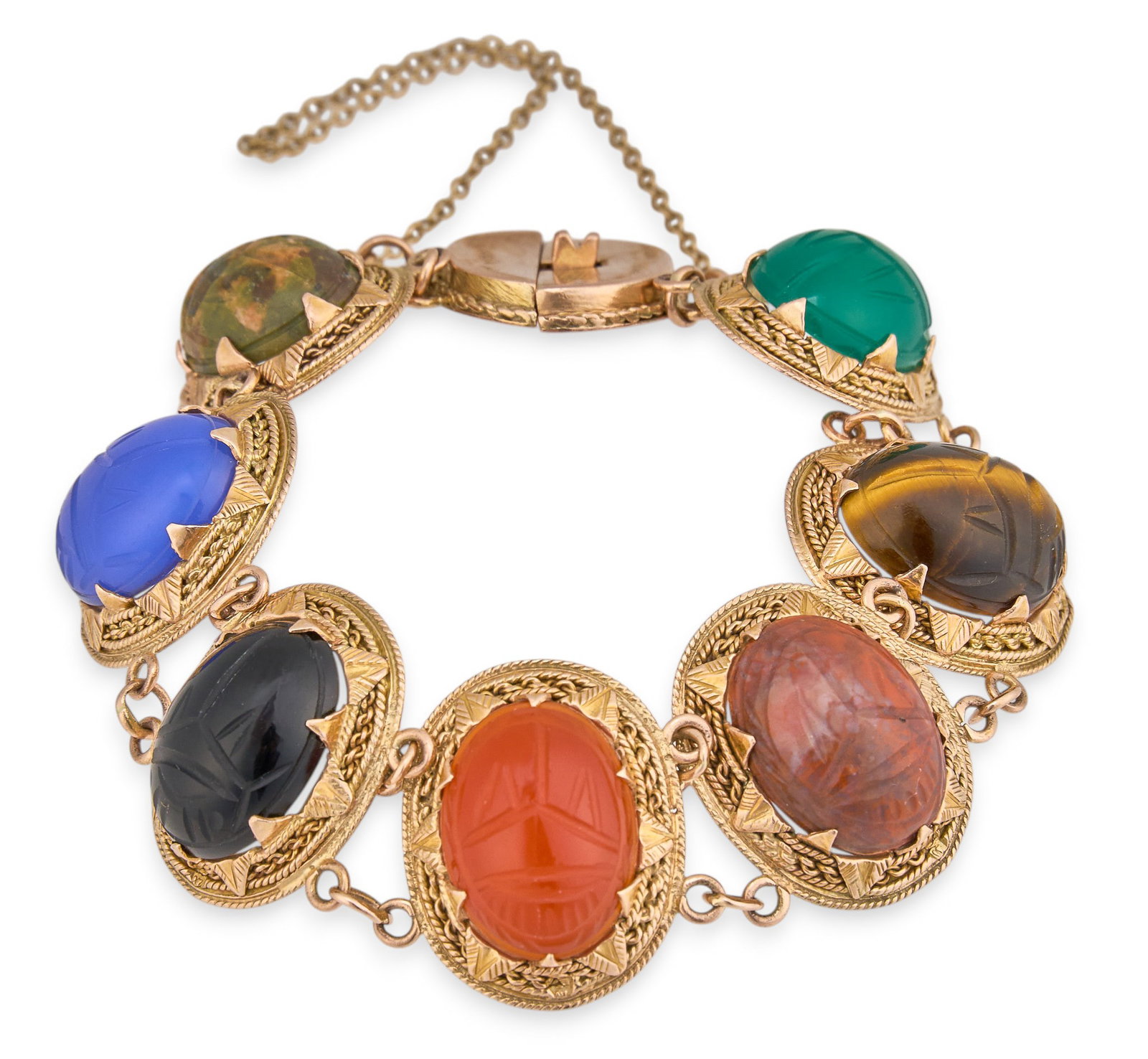 14K Multi-Stone Scarab Bracelet: 14K yellow gold (tested) scarab link bracelet, set with carved multi-stone design depicting beetle motifs, with safety chain Length: 6.5 in. Total weight: 36.6 g Provenance: Property from a home in