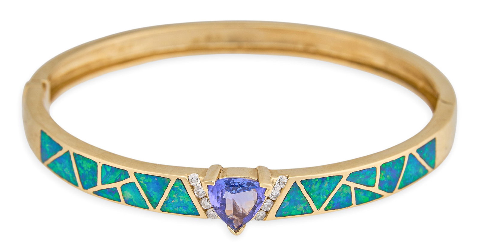 14K Tanzanite, Opal, and Diamond Hinged Cuff: 14K yellow gold hinged cuff bracelet, set with opal inlay in geometric design, trilliant cut tanzanite center stone, accented by eight round diamond details, marked "14K" Circumference: