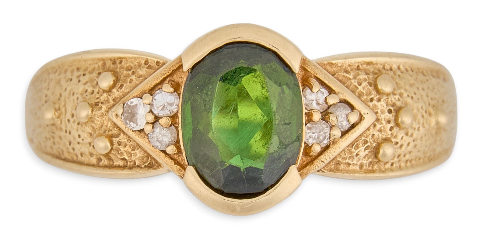 14K Peridot & Diamond Ring: 14K yellow gold ring, set with oval-cut peridot center stone, accented by round diamonds, textured design to shank, marked "14K" Size: 8.5 Total weight: 5.0 g Provenance: Property from