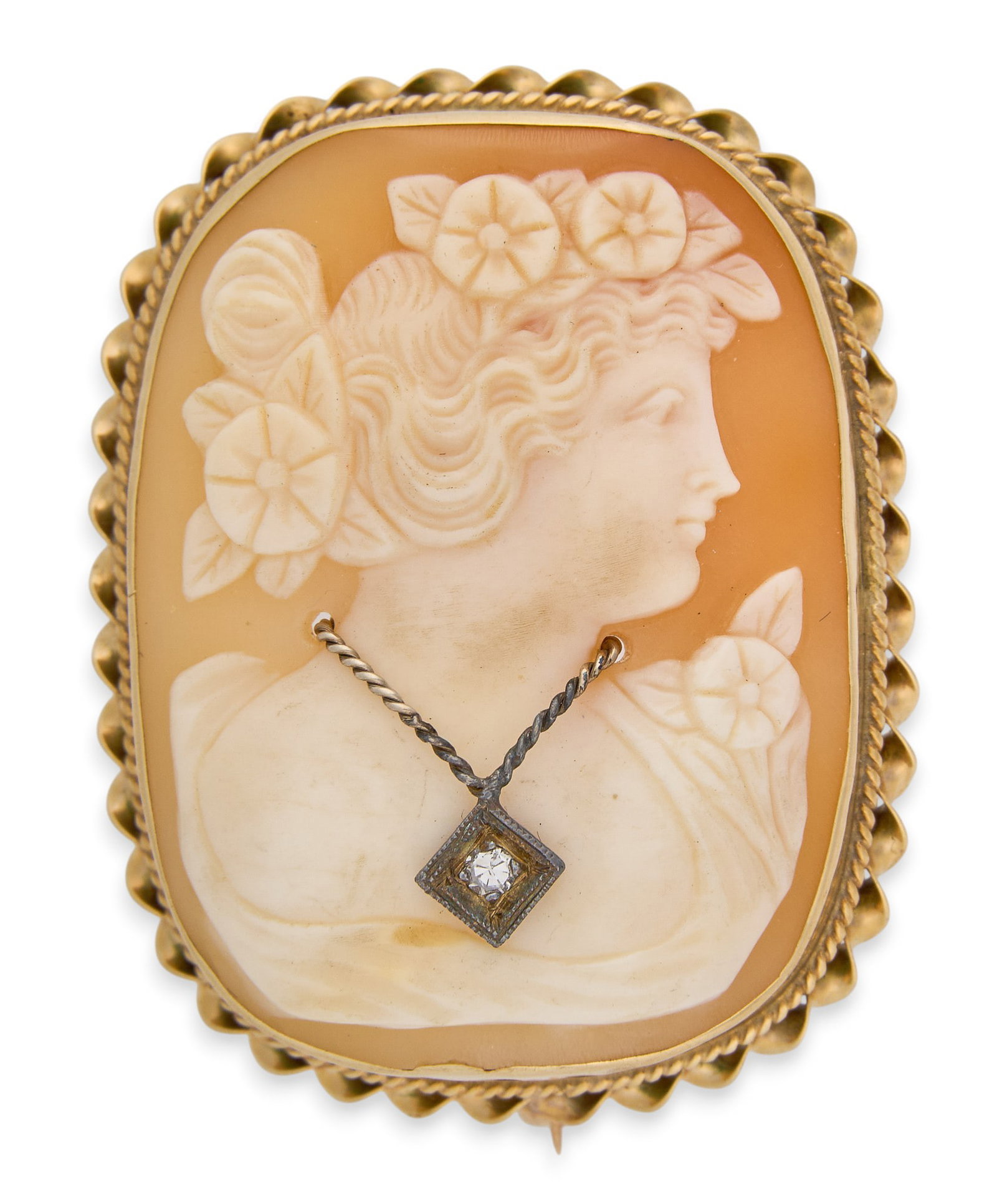 14K Cameo Brooch: 14K yellow gold (tested) carved shell cameo brooch, depicting female figure's side profile, featuring round diamond accent to necklace motif, in twisted rope motif setting Size: 1.25