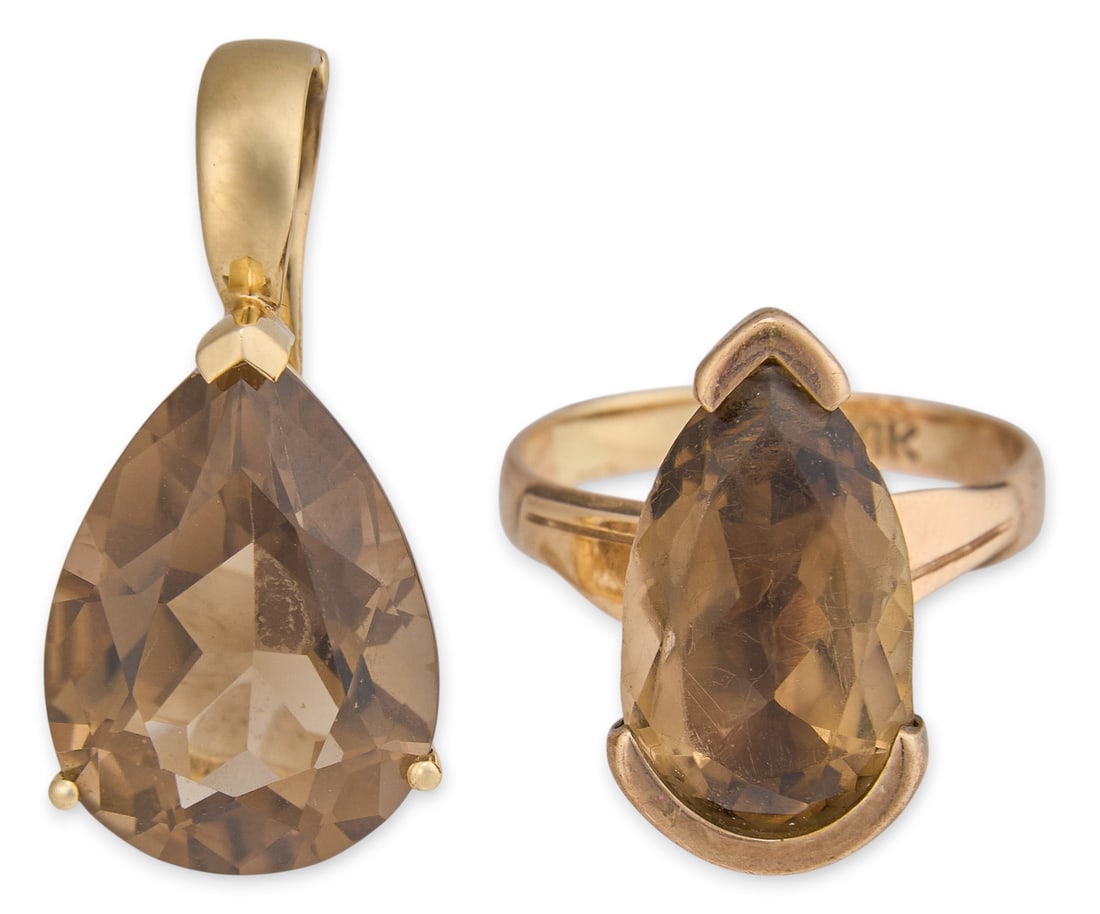 14K Smoky Quartz Pendant and Ring: 14K yellow gold ring and pendant set, each set with pear cut smoky quartz, pendant stone measuring 18.5 mm x 13.1 mm, ring stone measuring 16.1 mm x 9.6 mm and marked "14K" Ring size: