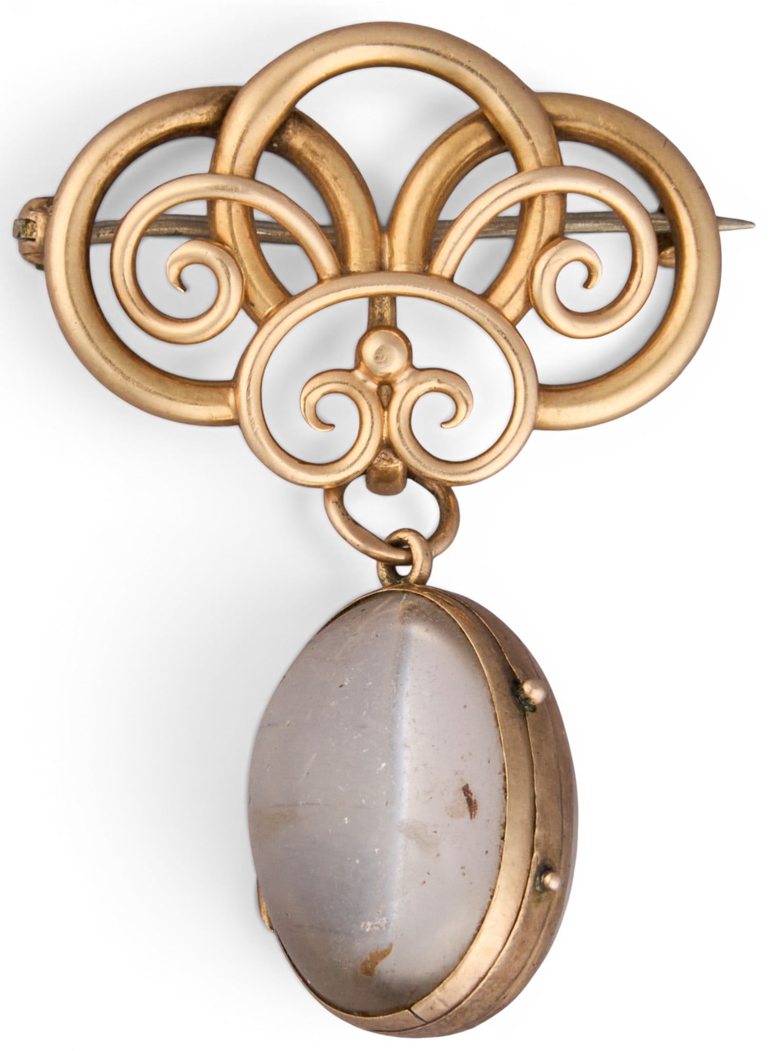 14K Locket Brooch: 14K yellow gold locket brooch, set with scrolled framework, and cabochon style locket, marked "14K" Size: 1.5 in. x 1 in. Total weight: 9.36 g Provenance: Property from an estate