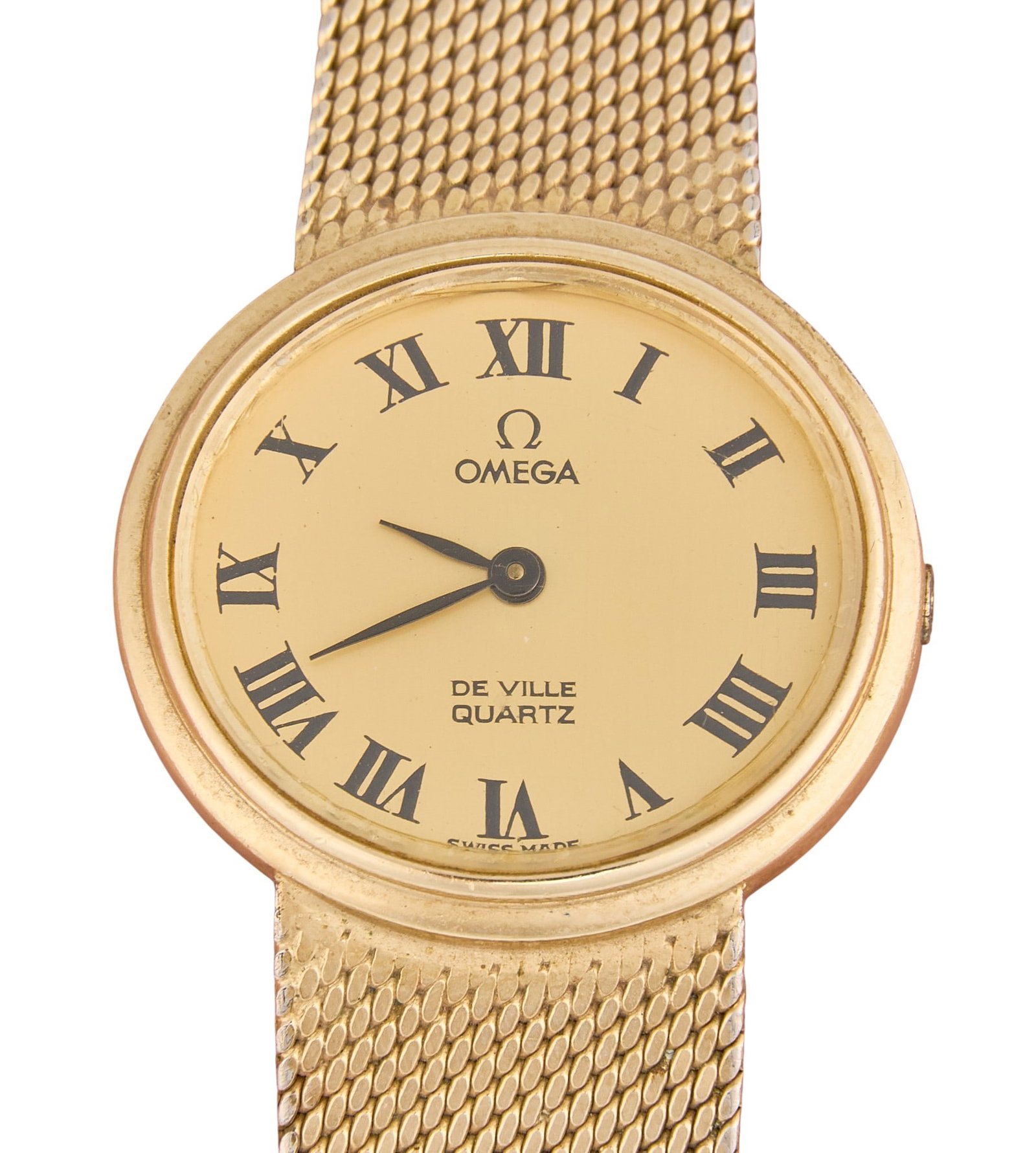 Omega Quartz Watch: Omega De Ville Quartz wristwatch, 10K gold filled, oval case with champagne dial, woven mesh bracelet, case and integrated mesh bracelet stamped "OMEGA 10 KT. G.F." Length: 7 in. Total weigh