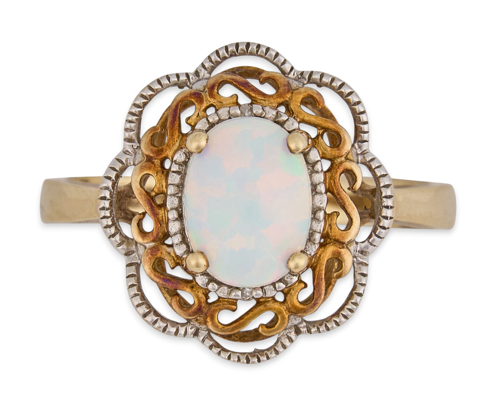 10K Two-Tone Opal Filagree Ring: 10K two-tone gold ring, set with opal cabochon center stone, featuring filagree details, marked "10K" Size: 7 Total weight: 2.5 g Provenance: Property from a home in San Antonio, Texas