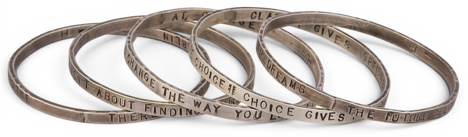 (5) Sterling Silver Bracelets: Group of five sterling silver bracelets, each stamped with quotes to exterior, marked "Sterling" Circumference: 7.75 in. Total weight: 2.47 ozt Provenance: Property from an estate