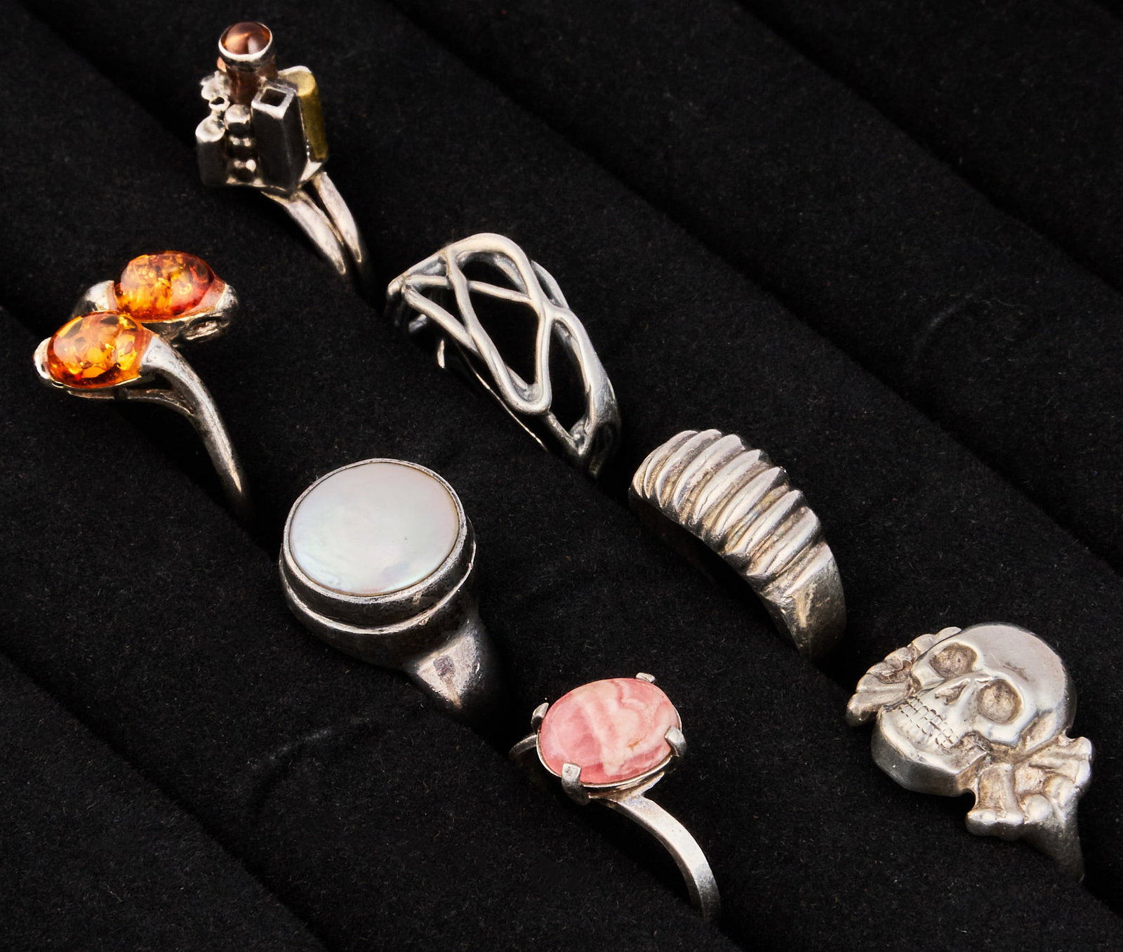 (7) Sterling Silver Rings: Group of seven sterling silver rings, in assorted sizes and styles Size: 5.5-9 Total weight: 1.15 ozt Provenance: Property from an estate collection at a home in the Lincoln Heights