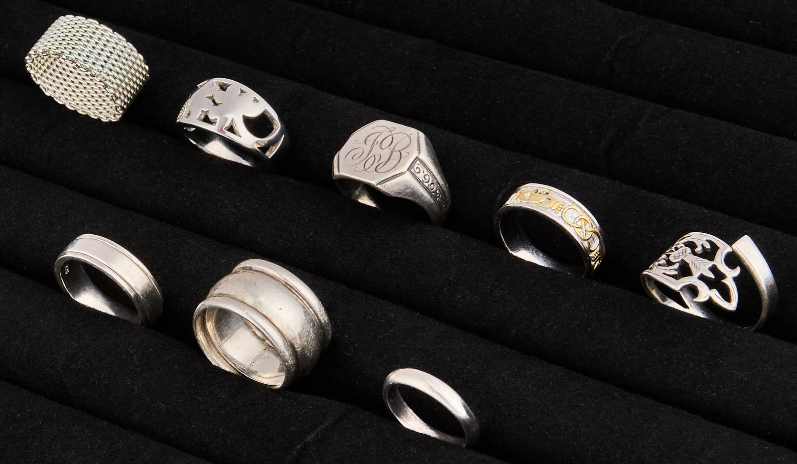 (8) Sterling Silver Rings: Group of eight sterling silver rings, in assorted sizes and styles Size: 5.5-10 Total weight: 1.53 ozt Provenance: Property from an estate collection at a home in the Lincoln Heights neighborhood of