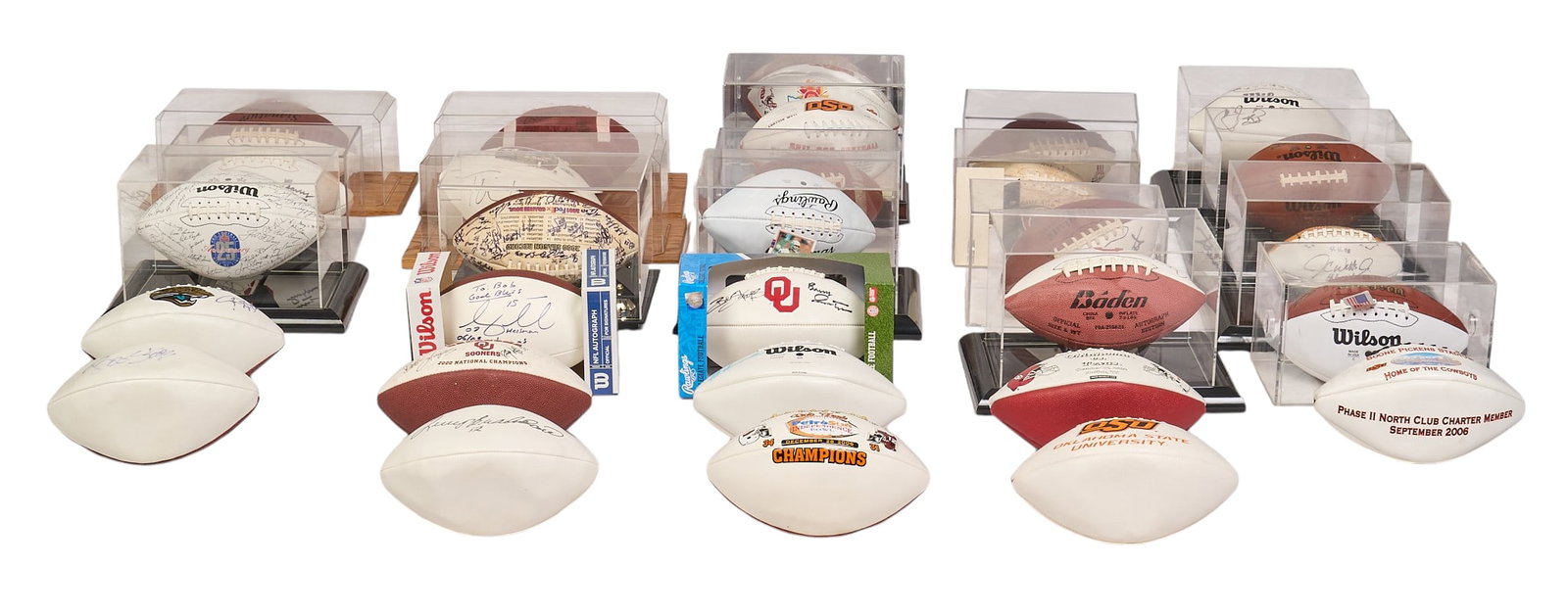 (28) Signed Footballs: Collection of twenty-eight signed footballs, with signatures from such athletes as Barry Switzer, Bob Stoops, Mike Gundy, Billy Sims, Steve Owens, and Jason White, Jason White, and