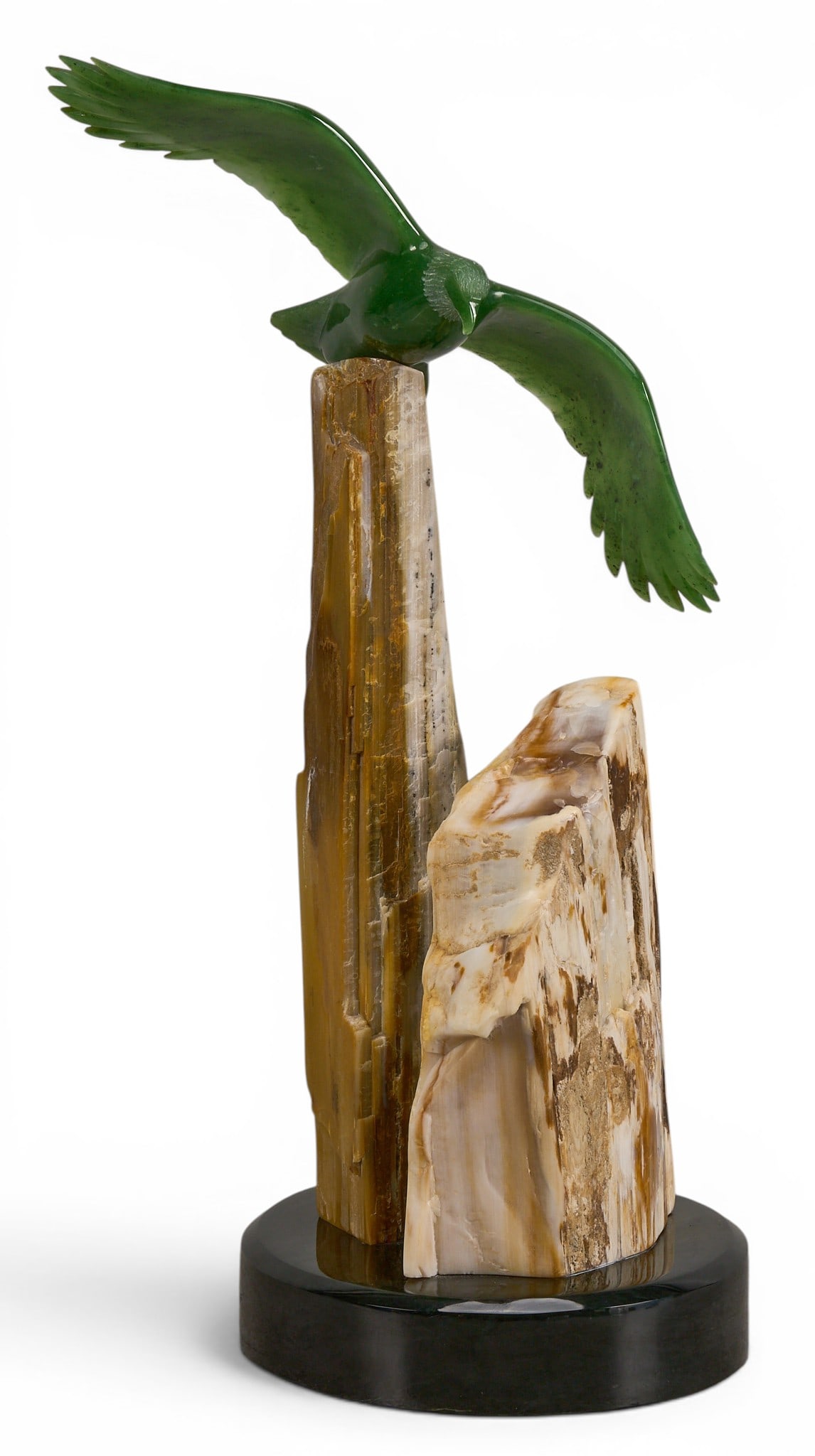 Lyle Sopel, Eagle: Lyle Sopel (20th century) polished green nephrite and petrified wood sculpture depicting eagle, signed on base, and marked "F691" height 16.5 in. x width 8.5 in. x depth 6 in.&nbs