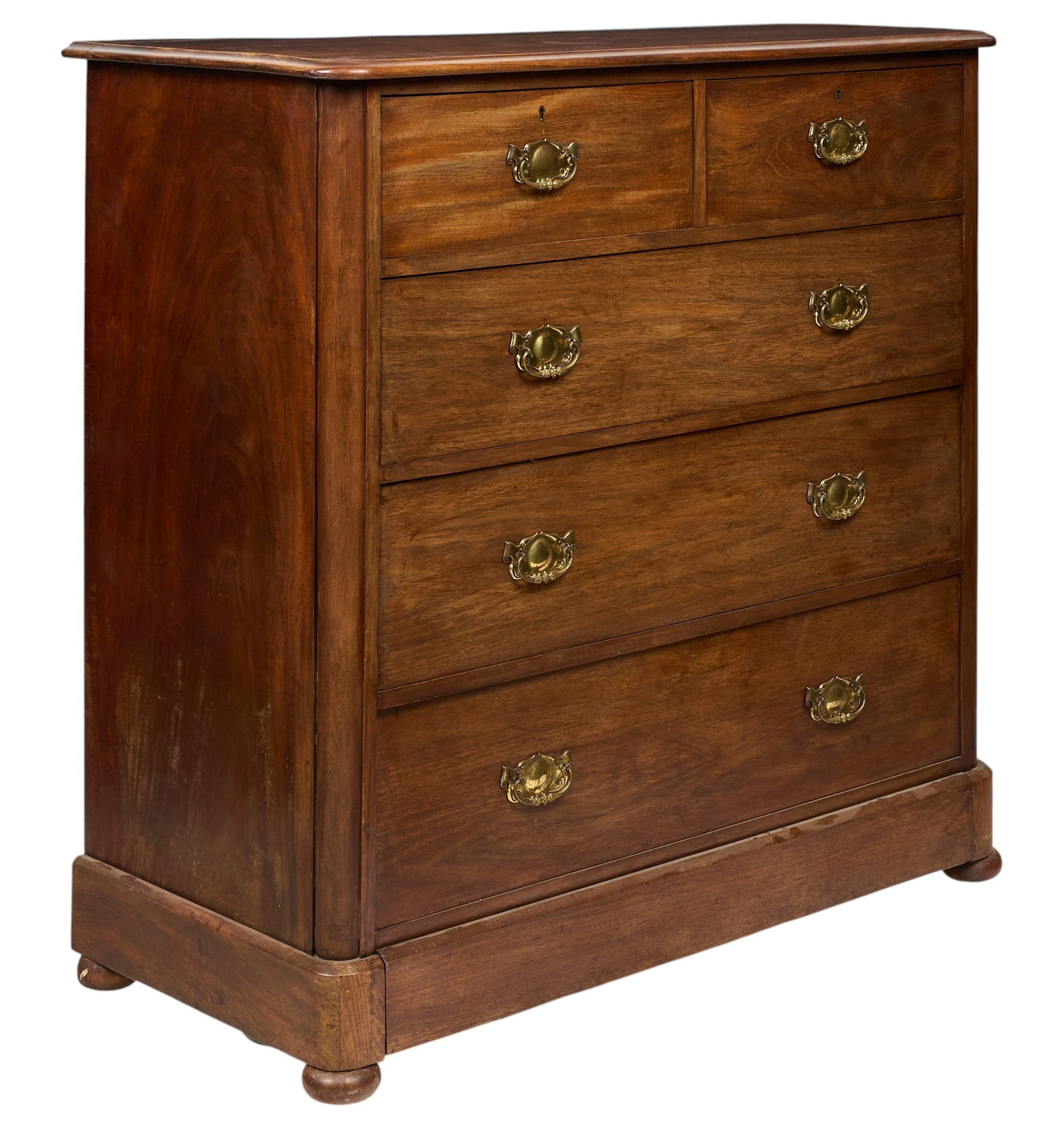 Chest of Drawers: Vintage chest of drawers with decorative pulls, on bun feet height 44 in. x width 45 in. x width 21 in. Provenance: Property from a home in San Antonio, Texas