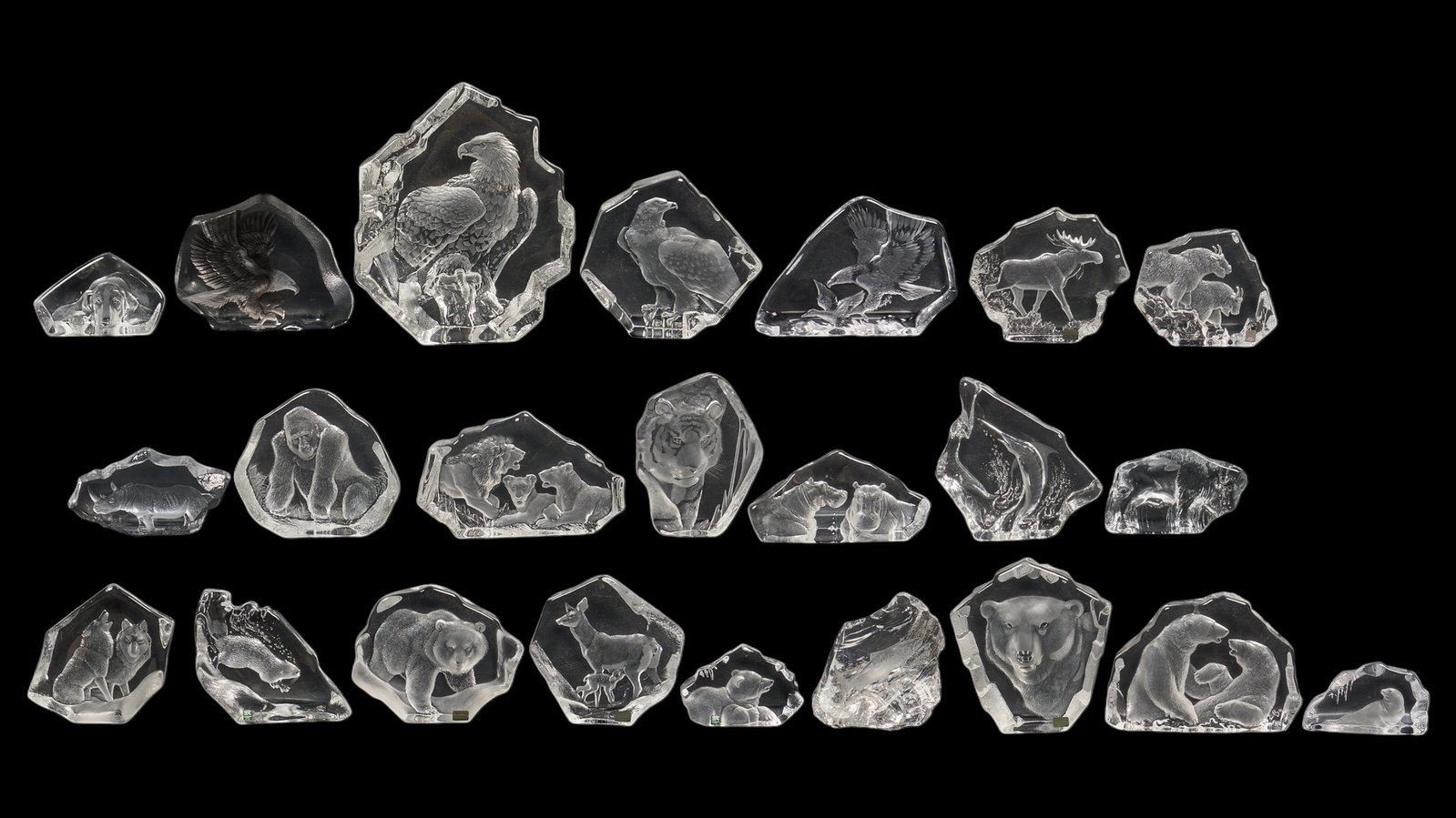(23) Mats Jonasson Animal Crystal Sculptures: Collection of twenty-three Mats Jonasson (Sweden) glass sculptures depicting reliefs of various animals height 13 in. x width 11 in. x depth 3.5 in. / largest Provenance: Property