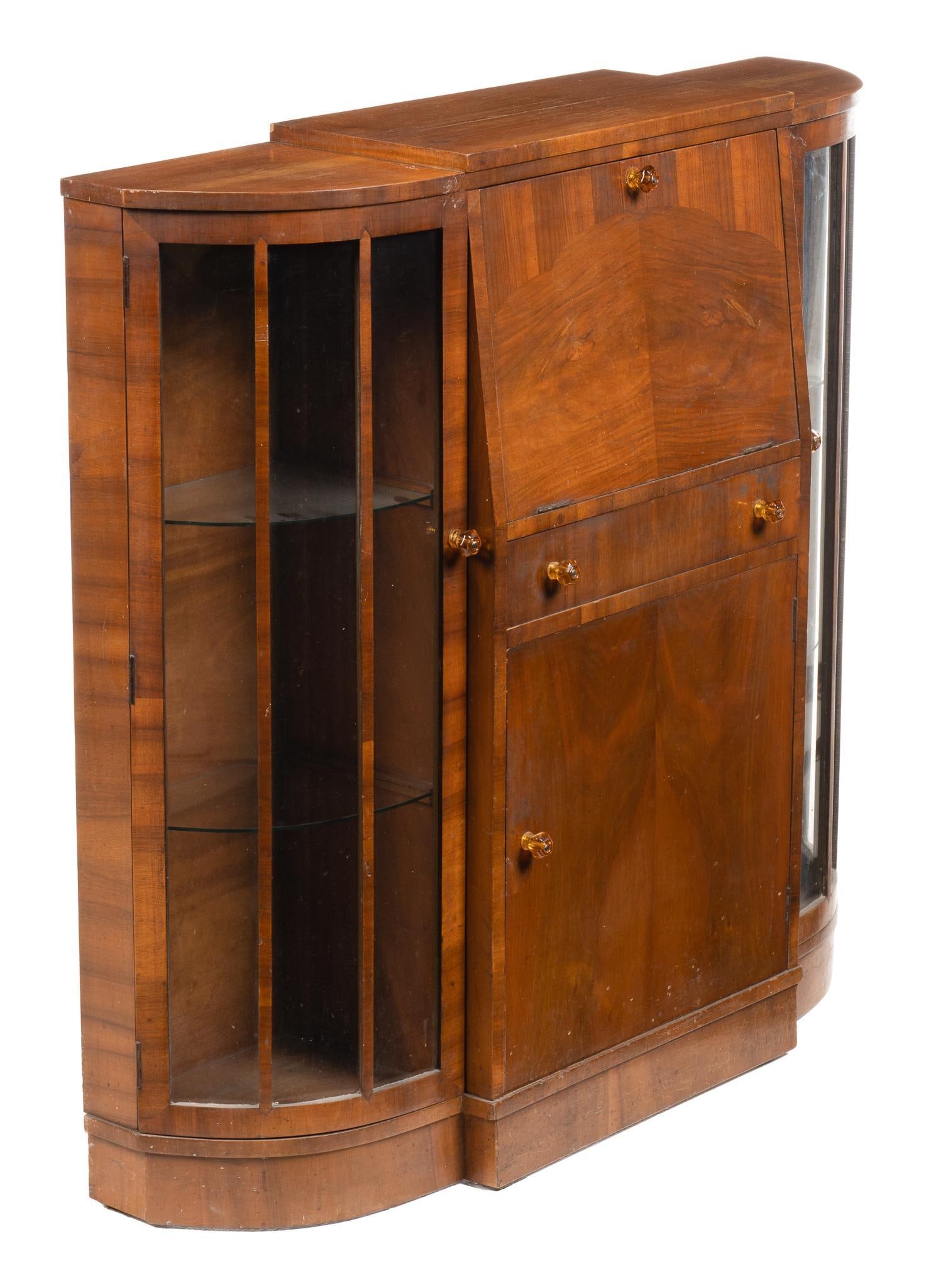 Art Deco Style Desk: Art deco style desk with glass shelves and fitted storage height 45.5 in. x width 48 in. x depth 12 in. Provenance: Property from a home in San Antonio, Texas 
