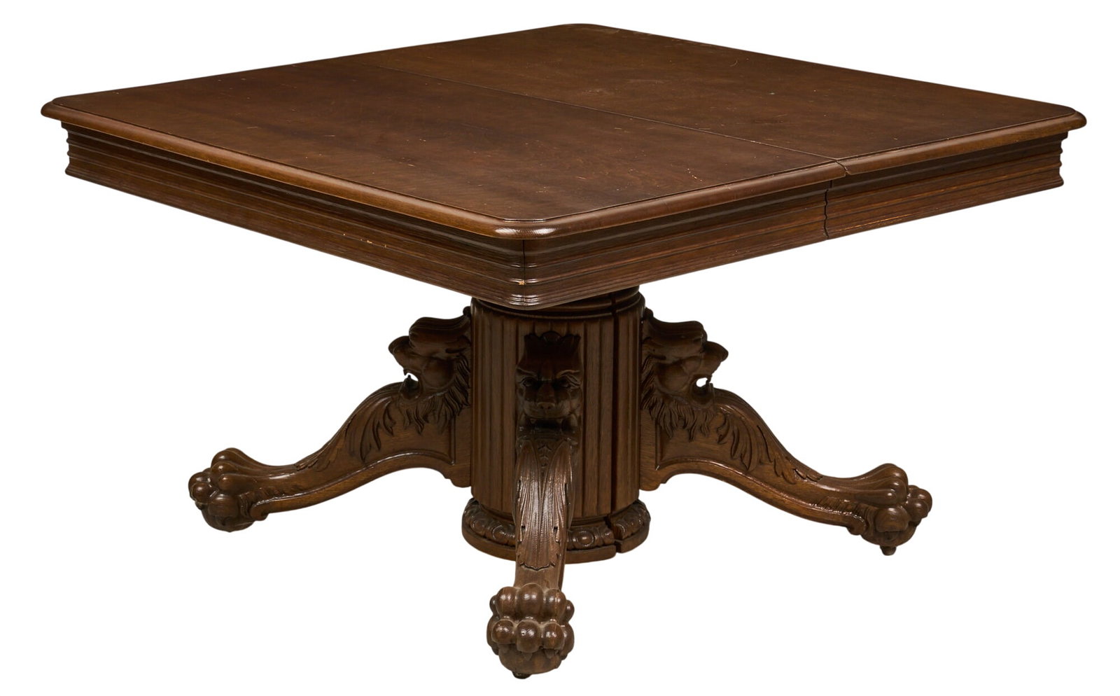 Vintage Dining Table: Vintage dining table with six leaves, supported on carved legs with casters height 30 in. x width 48 in. x depth 48 in. / closed Provenance: Property from a home in San Antonio, Texas Condition: