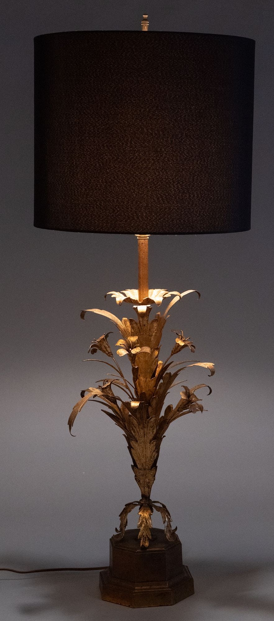 Frederick Cooper Gilt Floral Lamp: Vintage Frederick Cooper table lamp with tin foliate motifs with gold finish and black fabric shade, in working condition height 40.5 in. x width 16 in. x depth 16 in.