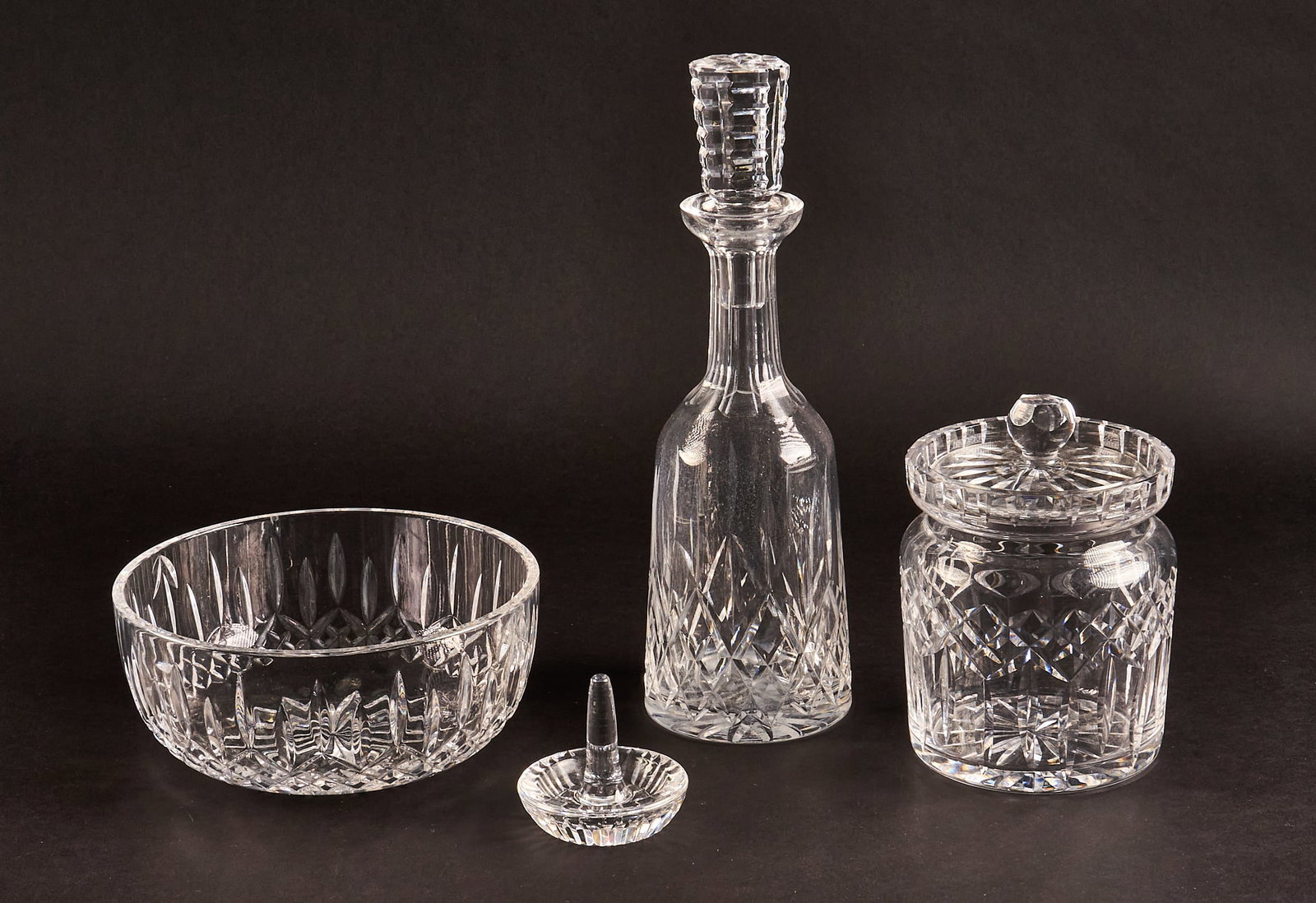 (4) Waterford "Lismore" Tableware and Accessories: Collection of four crystal items by Waterford in the "Lismore" pattern, includes biscuit barrel, ring holder, bowl, and decanter height 3.5 x diameter 8 in. / bowl Provenance: Property from