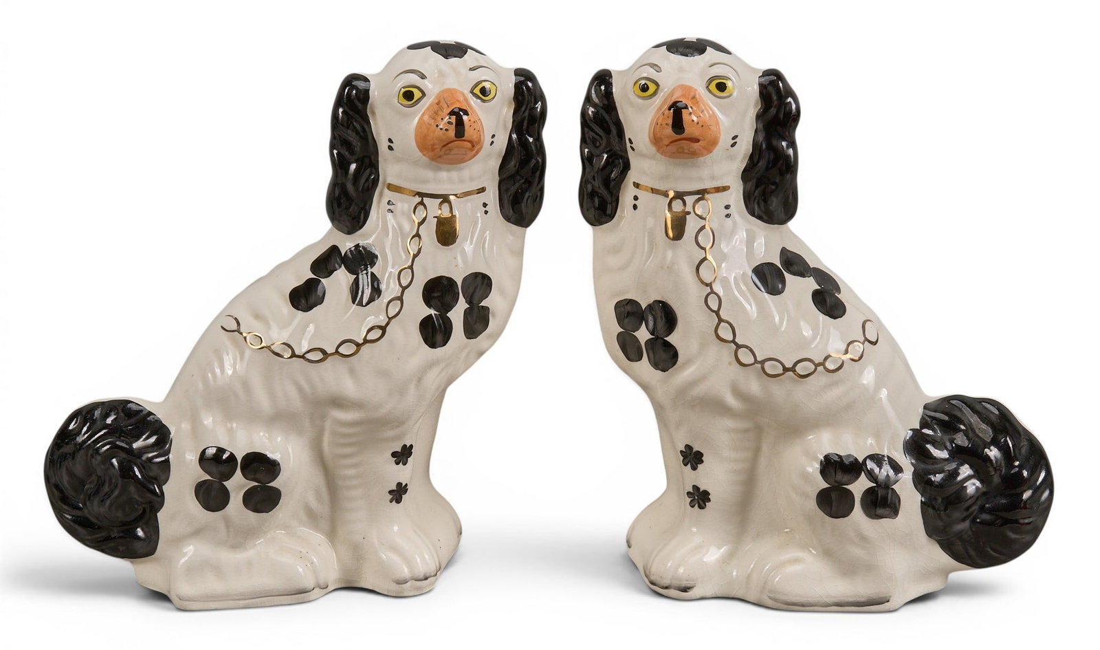 Pair of Porcelain Staffordshire Dog: Pair of Staffordshire porcelain spaniel dogs, marked Arthur Wood (England) on bottom height 11 in. x width 10 in. x depth 4 in. / each Provenance: Property from a home in Chicago, Illinois