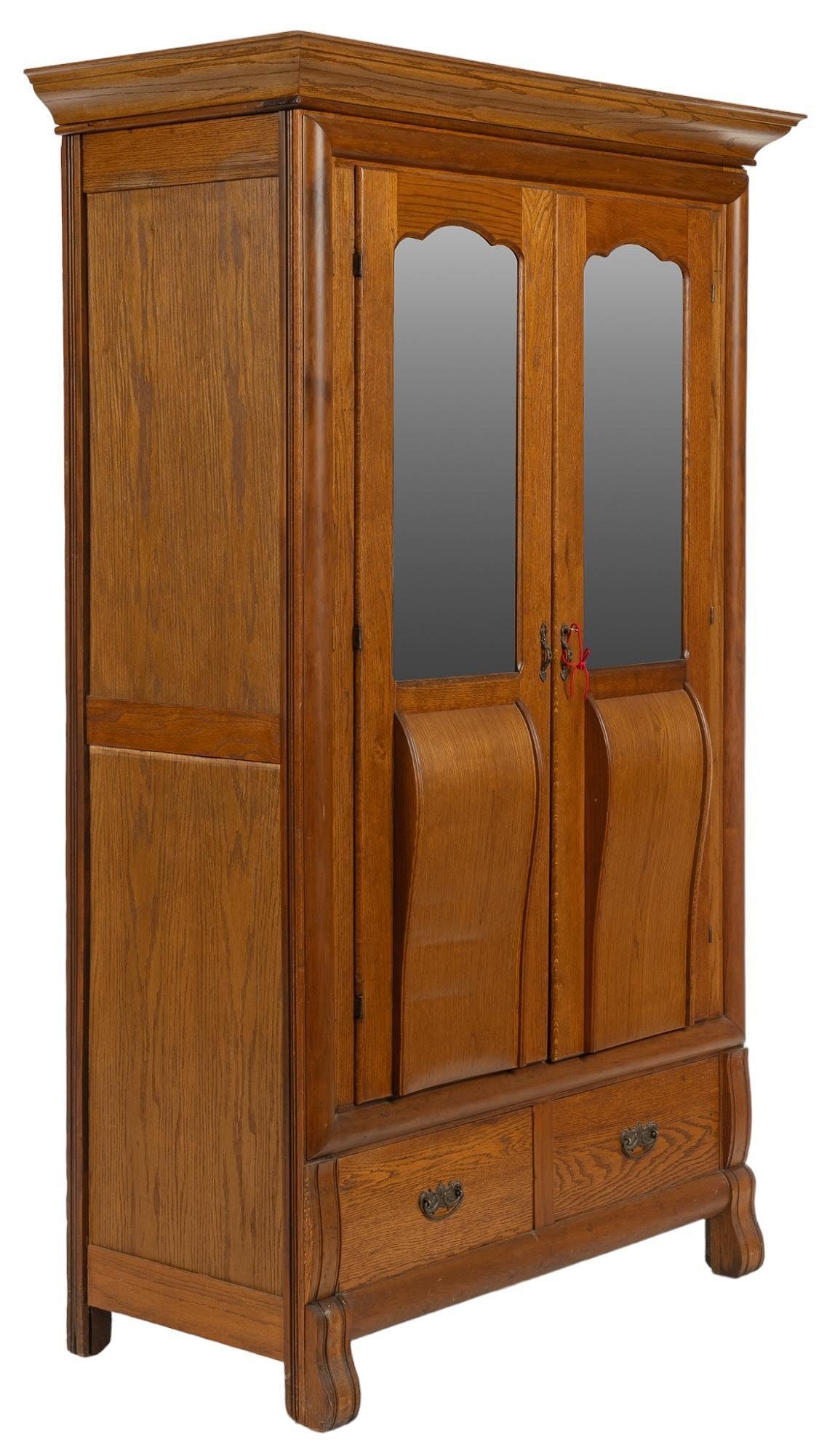 Mirrored Wardrobe: Mirrored wardrobe, featuring oversize crown, above pair of cabinet doors with beveled glass inserts with scalloped design, opening to interior storage with single shelf, above two drawers with metal