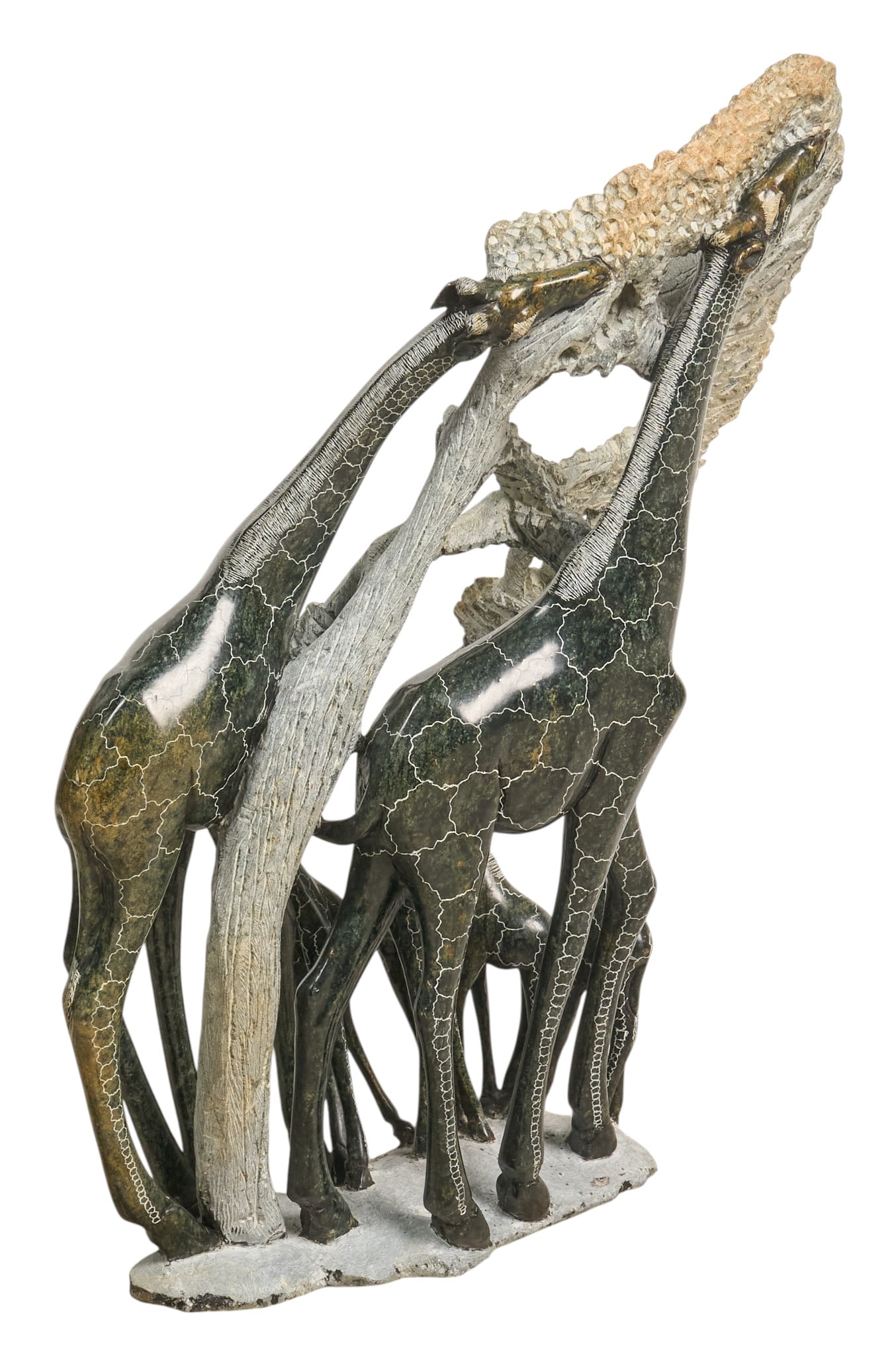 Giraffe Soapstone Sculpture: Carved green soapstone sculpture depicting giraffes eating leaves on trees, signed by unidentified artist height 29 in. x width 20 in. x depth 12 in. Provenance: Property from the Estate