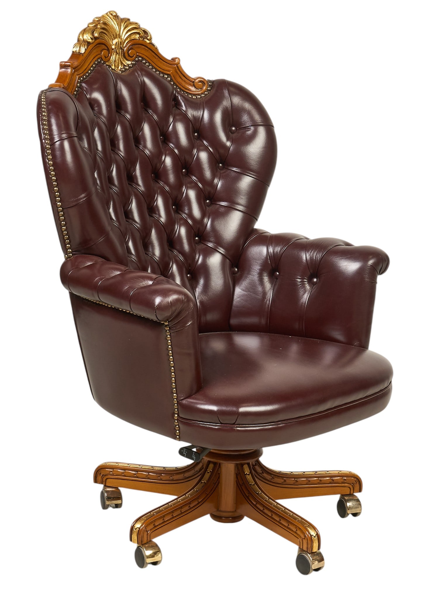 Chesterfield Tufted Leather Rolling Chair: Chesterfield tufted oxblood leather rolling office chair with decorative crest height 49 in. x width 32 in. x depth 32 in. Provenance: Property from the Estate of Robert A. "Bob" Funk S