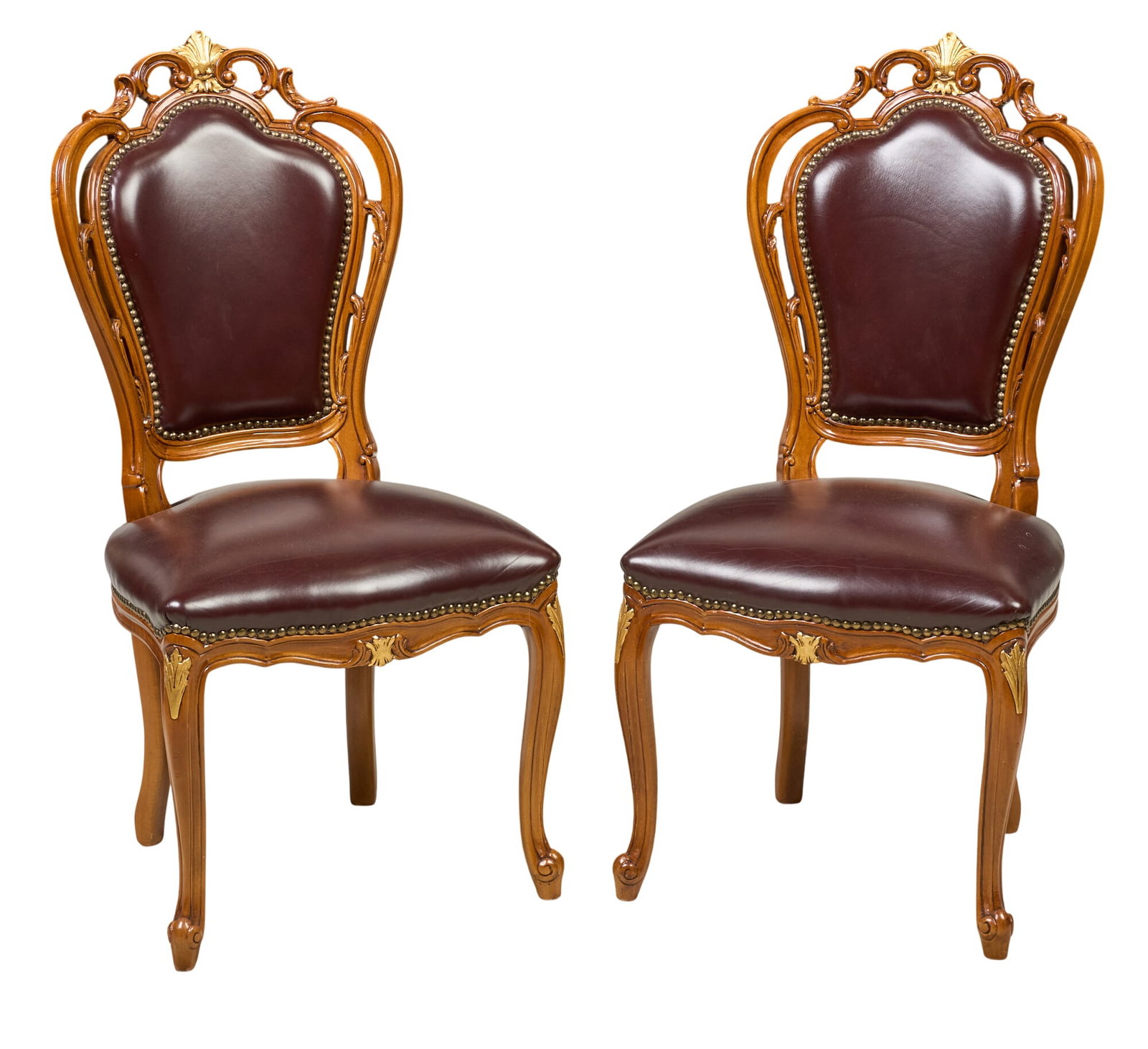 Pair of Louis XV Style Leather Side Chairs: Pair of Louis XV style side chairs with decoratively carved frames and leather seating height 41 in. x 20.5 in. x depth 23 in. / each Provenance: Property from the Estate of Robert A. "Bob&