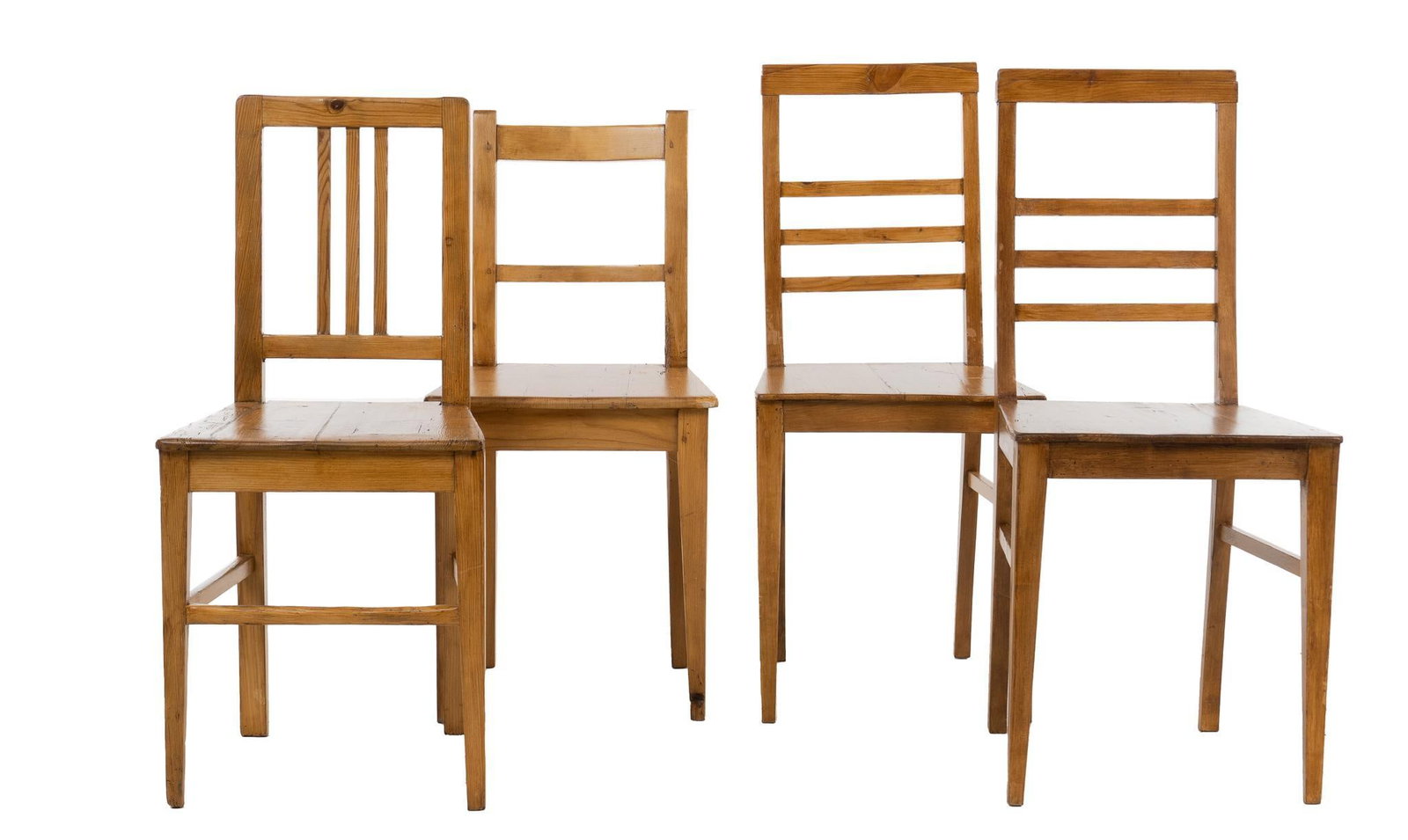 (4) Farmhouse Chairs: Four wooden chairs, to include two matching with ladder back, one with a three slat back, three supported on stretchered legs height 38 in. x width 17 in. x depth 17 in. / tallest Provenance: