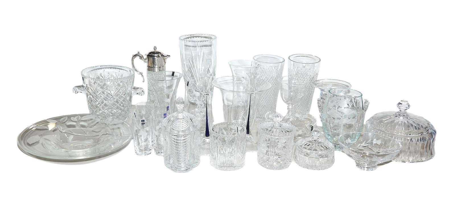 Collection of European Crystal Glassware: Collection of various crystal glassware, includes such makers as Mats Jonasson, Orrefors, and Gleneagles; includes various vases, a serving platter, a pitcher, and decorative jars height 22 in.