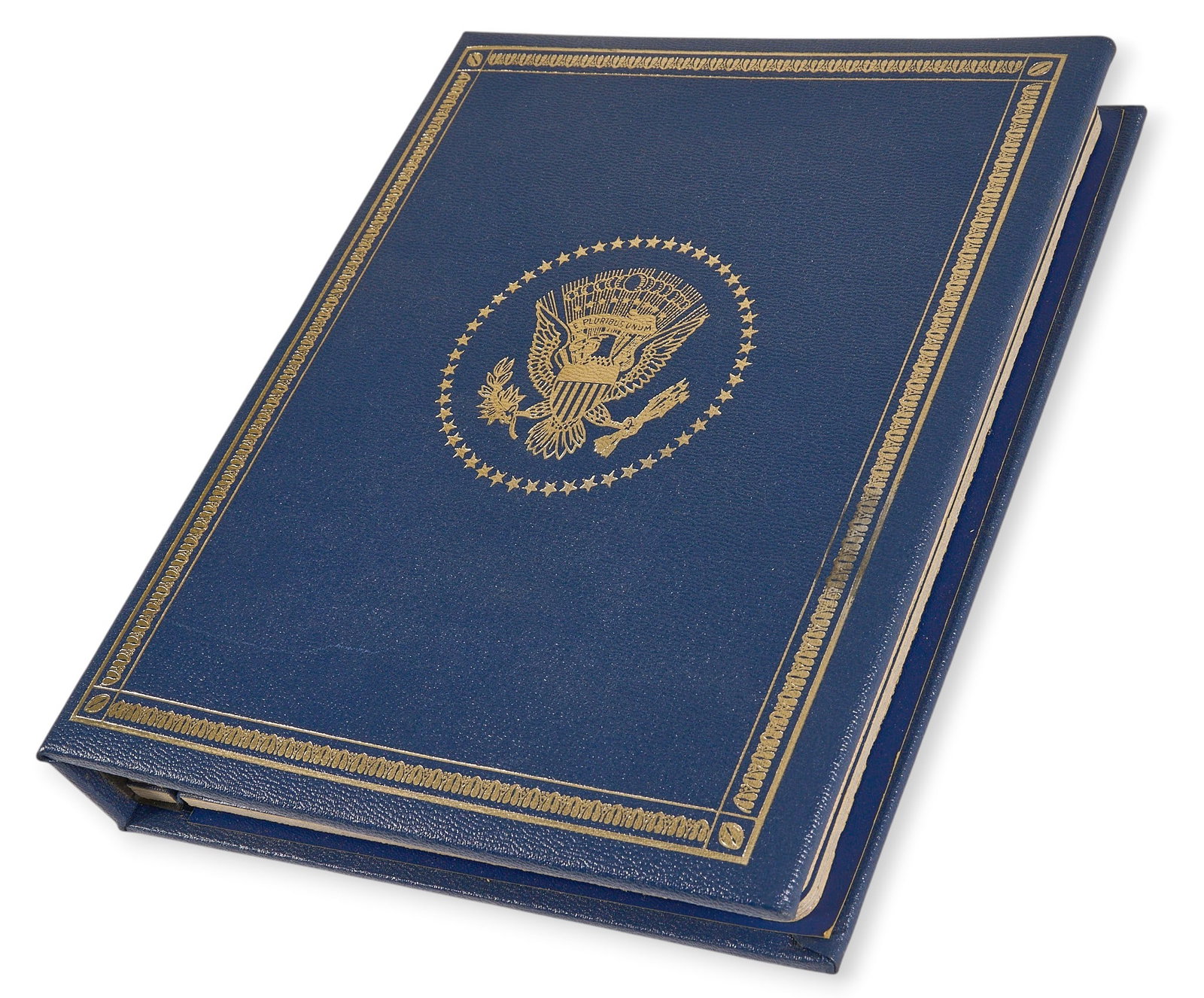 Silver Presidential Profiles Collection: A collection of silver coins featuring profiles of U.S. Presidents, housed in a blue binder with gold embossed presidential seal height 11 in. x width 8.5 in. x depth 1.5 in. Provenance: Property