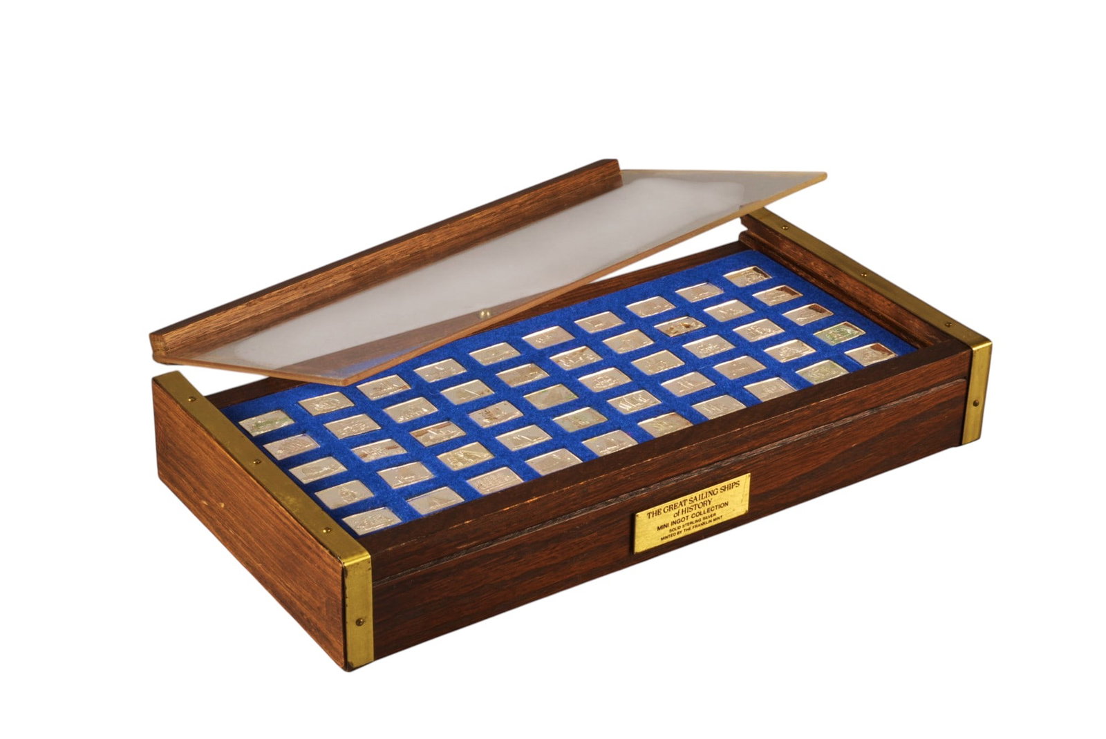 Franklin Mint Sterling Silver "Great Sailing Ships" Ingot Collection: Franklin Mint "The Great Sailing Ships of History" mini ingot collection, solid sterling silver ingots, minted by The Franklin Mint, displayed in a wood frame with blue velvet lining, each