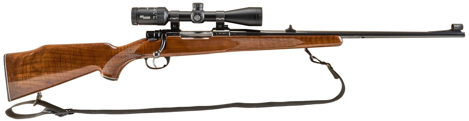 Zastava Interarms Mark X 30-06 Bolt Action Rifle W/ Sig Sauer Scope: Serial: B90057 Manufacturer: Zastava / Interarms-Manchester, England - Alex., VA (c. 1975) Model: Mark X (M98 action) Caliber: 30-06 SPRG Barrel length: 24 in. OAL: 45 in. Condition: Very good; light-