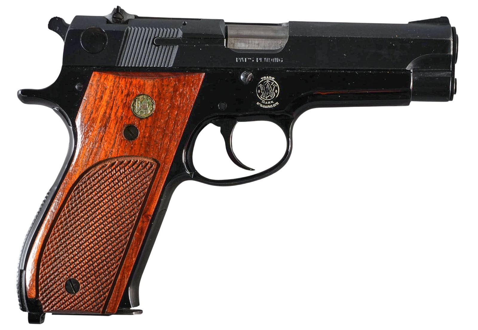 Smith & Wesson Model 39-2 9mm Semi Auto Pistol: Serial: A233694 Manufacturer: Smith & Wesson (c. 1974) Model: 39-2 Caliber: 9mm Barrel length: 4 in. OAL: 7.75 in. Condition: Good; wood grips have light wear; slide & frame have light h