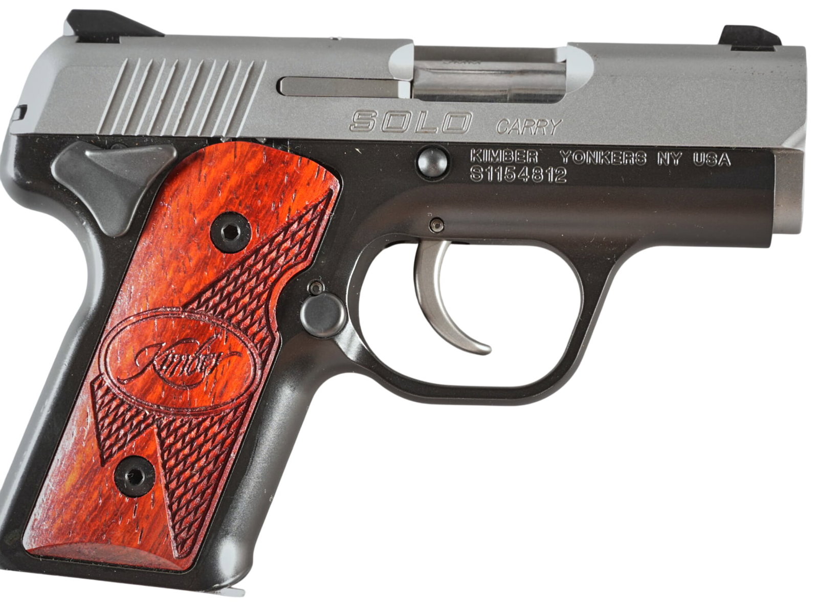 Kimber Solo Carry 9mm Semi Auto Pistol: Serial: S1154812 Manufacturer: Kimber-Yonkers, NY Model: Solo Carry Caliber: 9mm Barrel length: 2.75 in. OAL: 5.5 in. Condition: Very Good; light handling marks; few scratches Includes: Factory 