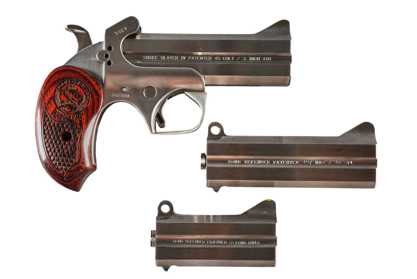 Bond Arms Snake Slayer IV 45LC/410 Bore Derringer w/ Extra Barrels: Serial: 102333 Manufacturer: Bond Arms Model: Snake Slayer Caliber: 45 LC / 410 Bore Barrel Length: 4.25 in. OAL: 6.375 in. Condition: Good; some light wear & handling marks; bores are all good wi