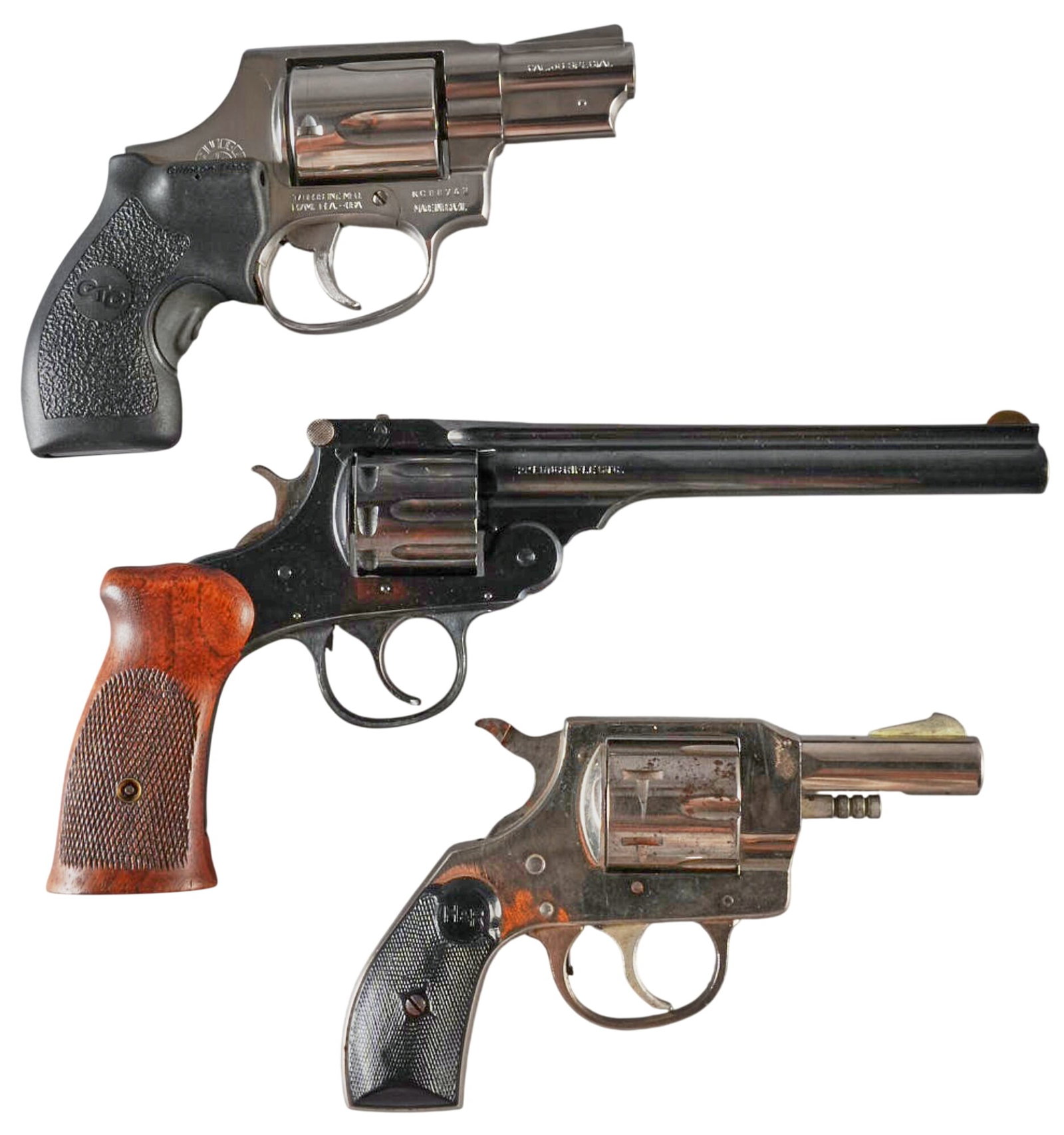 Lot of 3 Revolvers: Serial: (1) KC88743 ; (2) 549999 ; (3) AG42564 Manufacturer: (1) Taurus; (2&3) H&R Model: (1) 85; (22 Special; (3) 733 Caliber: (1) 38SPL; (2) 22LR; (3) 32 S&W Condition: Good; mostly ligh