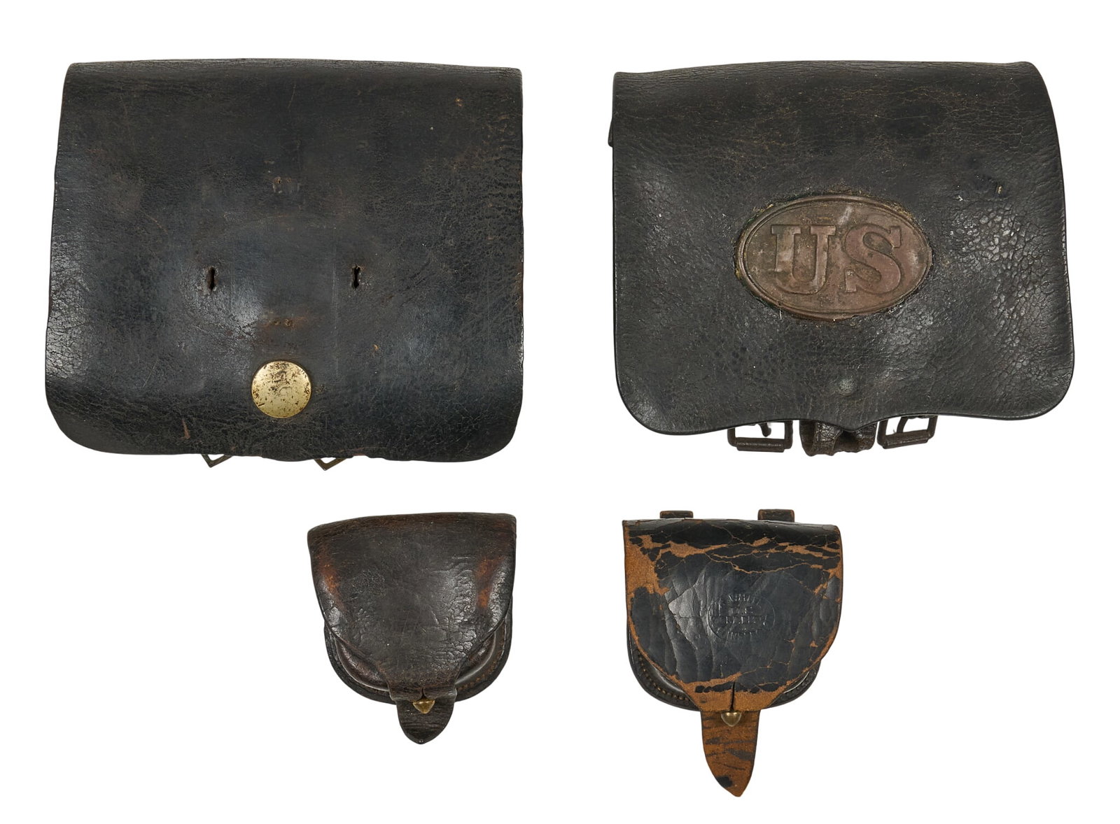 Grouping of US Civil War Leather Cap & Cartridge Boxes: Includes: -2 x 1855 leather cartridge boxes (one is misisng the "US" brass buckle on the flap; faded maker stamps; one has tin box inside); 8 in. x 6.5 x 3 in. 2 x leather cap boxes (o
