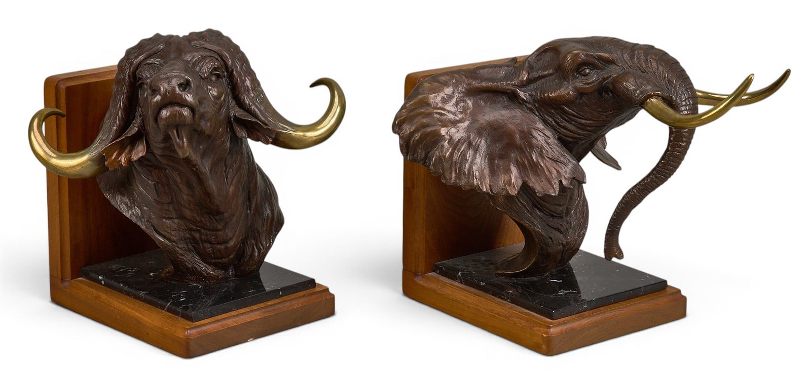 David Schaefer, Big Game Bookends: David Schaefer (Amer., 1949-2012), pair bookends, each being an artist-cast bronze sculpture, one elephant and one water buffalo, each with incised signature, edition number 65/450, and date, 1985