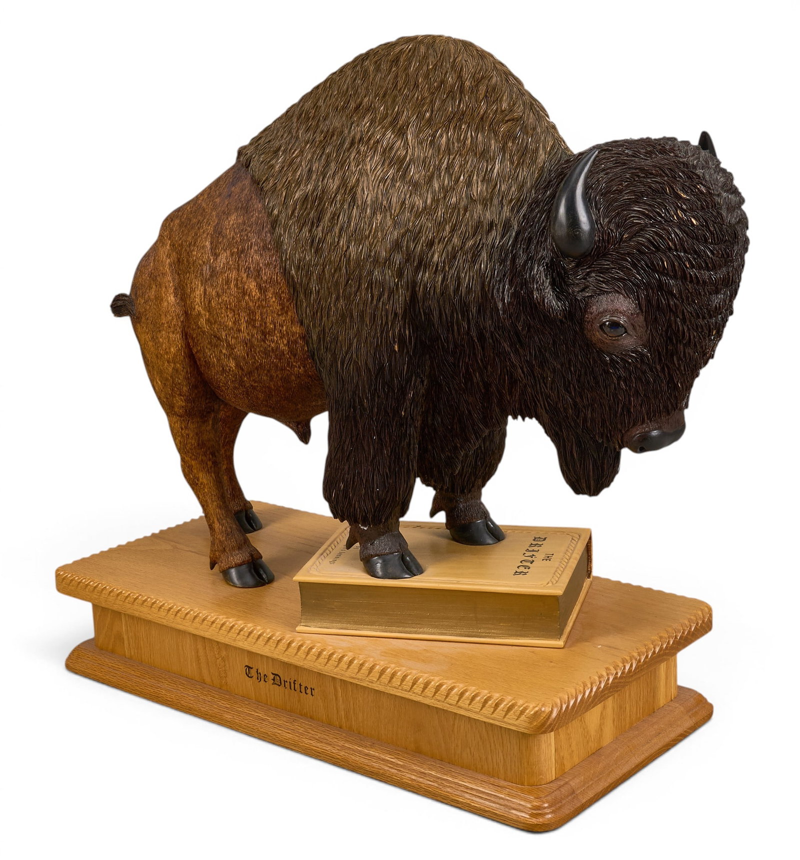 William Jennings, "The Drifter": William Rogers Jennings (Amer., b. 1942), "The Drifter", hand-carved wood bison sculpture, with hand-carved lettering, signed and titled in the wood height 20 in. x width 23.5 in. x