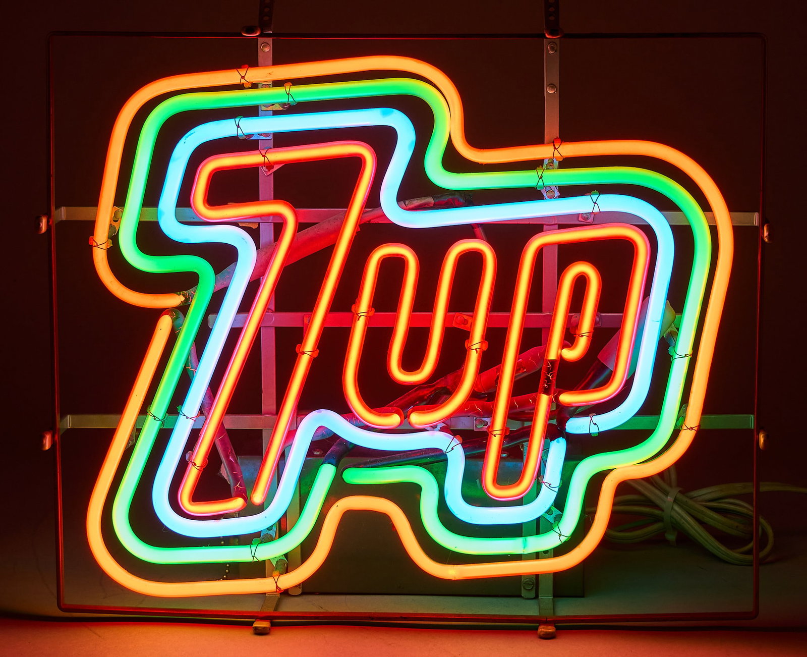 Vintage 7UP Neon Sign: Vintage 7UP neon sign, circa late 20th century, in working condition height 11 in. x width 18.5 in. x depth 5.5 in. Provenance: Property from a home in San Antonio, Texas