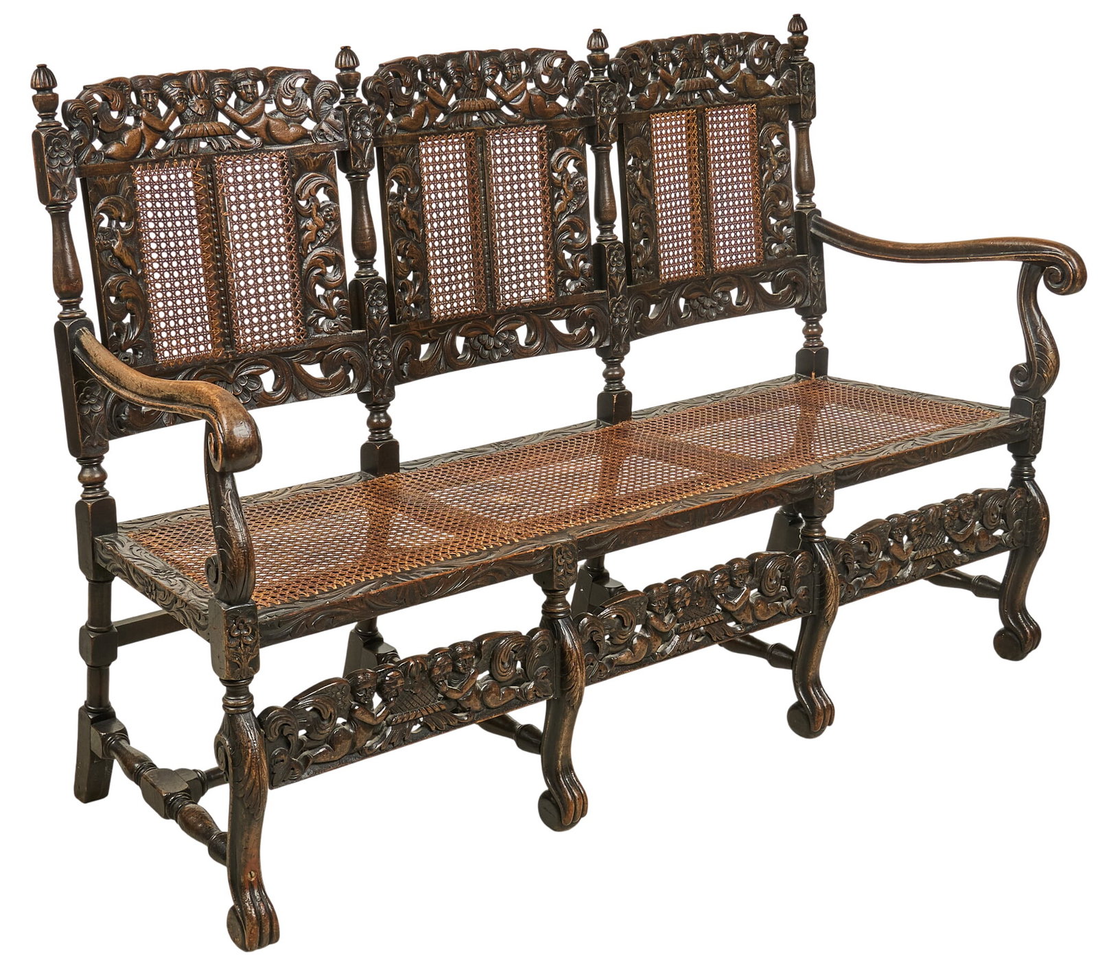 Cane Seated Bench: Vintage wooden bench with cane seating and scrolled armrests height 40 in. x width 62.5 in. x depth 32 in. Provenance: Property from a home in San Antonio, Texas 