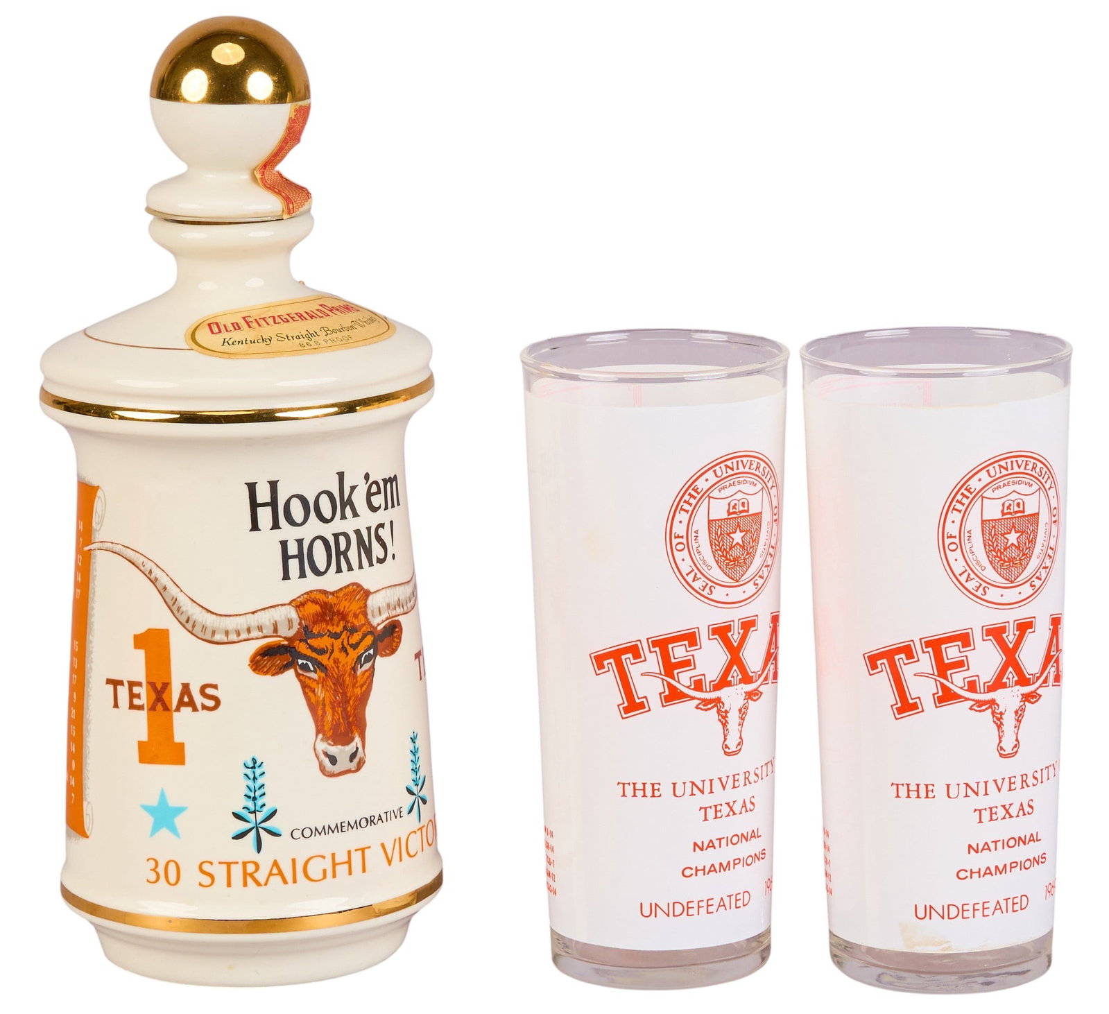 University of Texas Championship Decanter and Glasses Set: UT commemorative decanter and (2) championship glasses, decanter commemorating thirty straight victories, glasses featuring the UT logo and "Texas National Champions