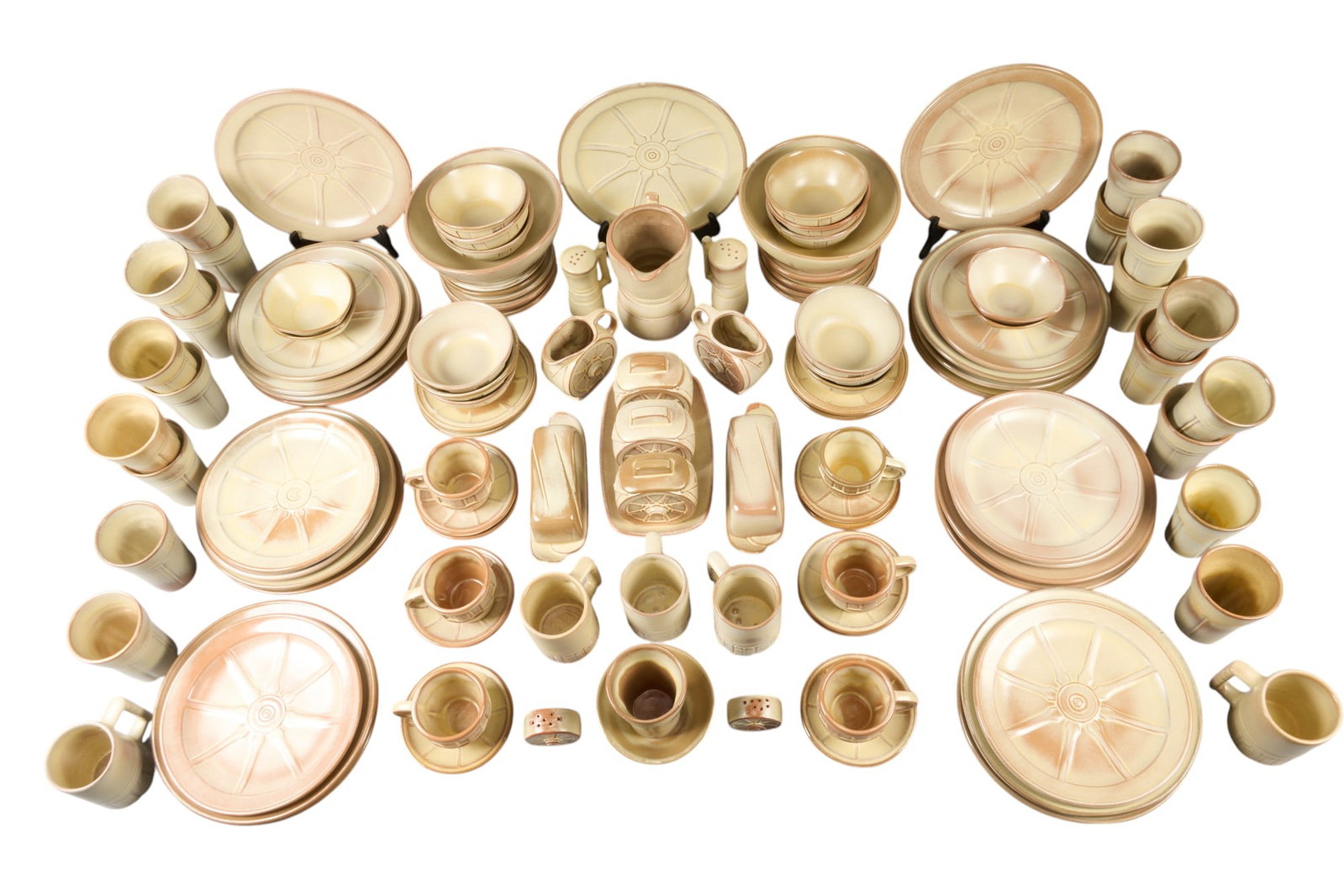 112 Pc. Frankoma Wagon Wheel Service: 112 piece set of marked Frankoma Wagon Wheel glazed ceramics, with cups, saucers, plates, bowls, mugs, salt and pepper shakers, cream and sugar containers, and pitcher height 8 in. x width 8 in.